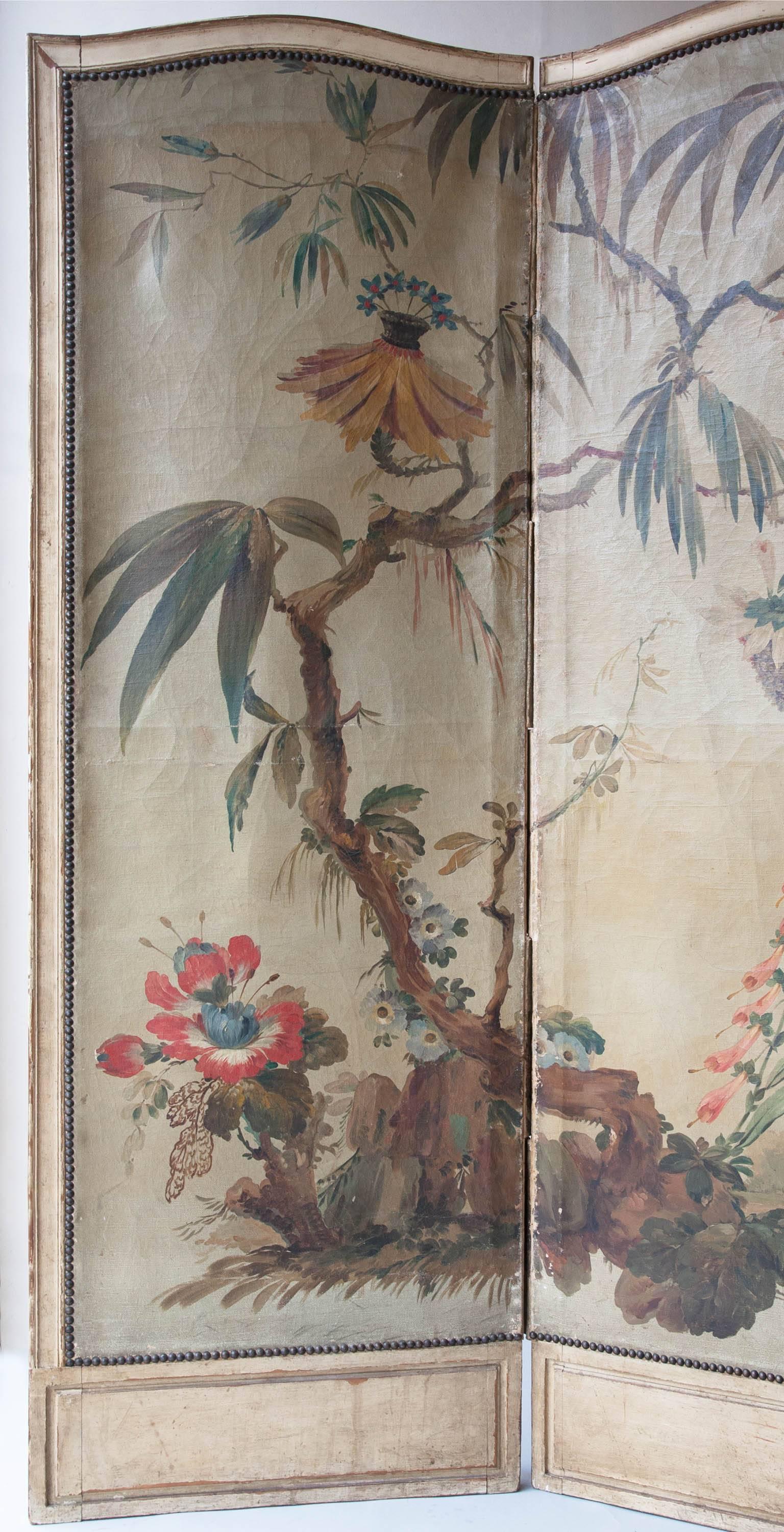 19th century five fold screen with painted oil on canvas panels. Decorated with exotic flowers and plants. 
The back panels covered in period damask of varying condition, 
France, circa 1860.
Measuires: Height: 189 cm (74½").
Three inside panel