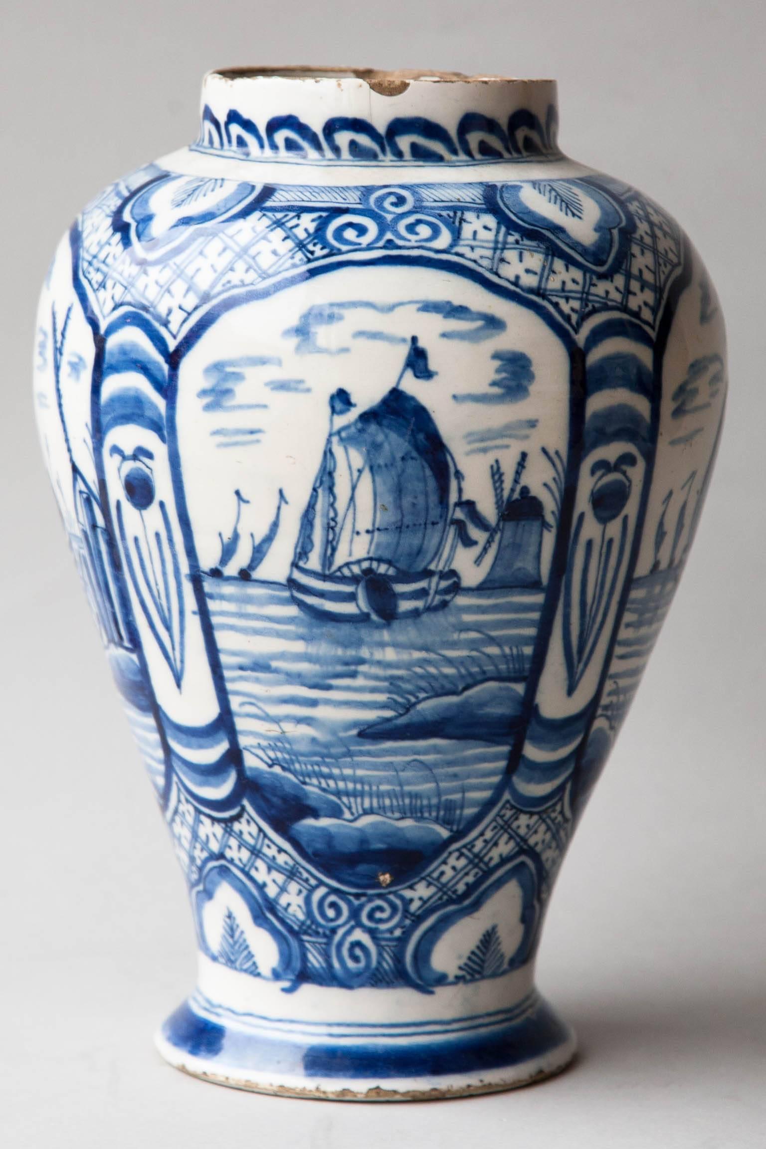 Decorated with four maritime scenes of ships within decorative cartouches.
Blue and white geometric designs surrounding the images,
Holland, circa 1780.