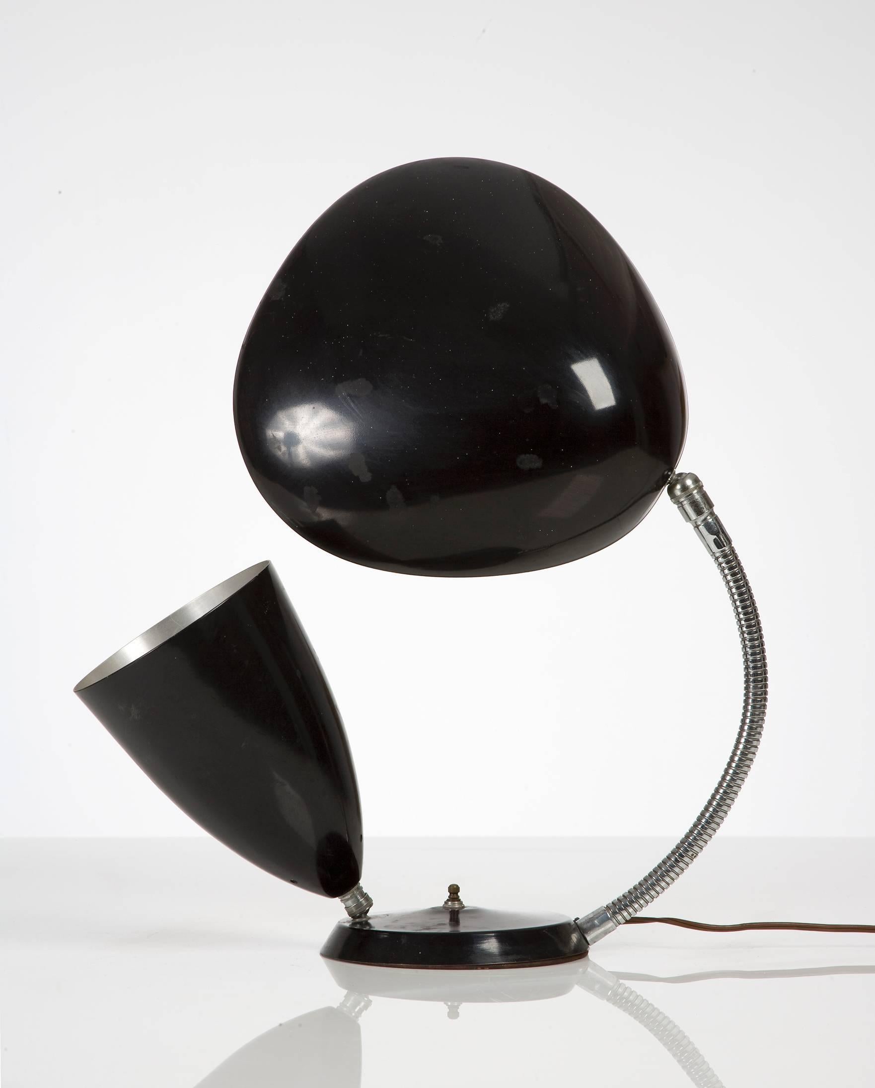 Table lamp in black enameled aluminum on a chrome-plated steel base with one cone shade and one 