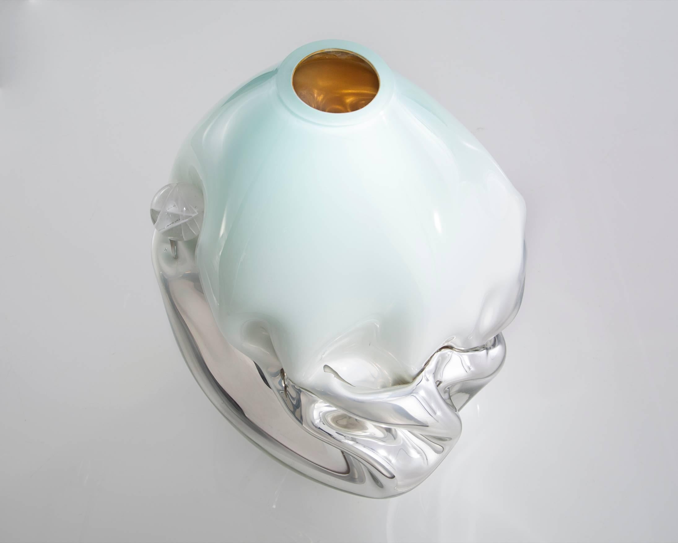 Unique crumpled sculptural vessel in silver mirrorized handblown glass with celedon top and glass gems. Designed and made by Jeff Zimmerman, USA, 2015.