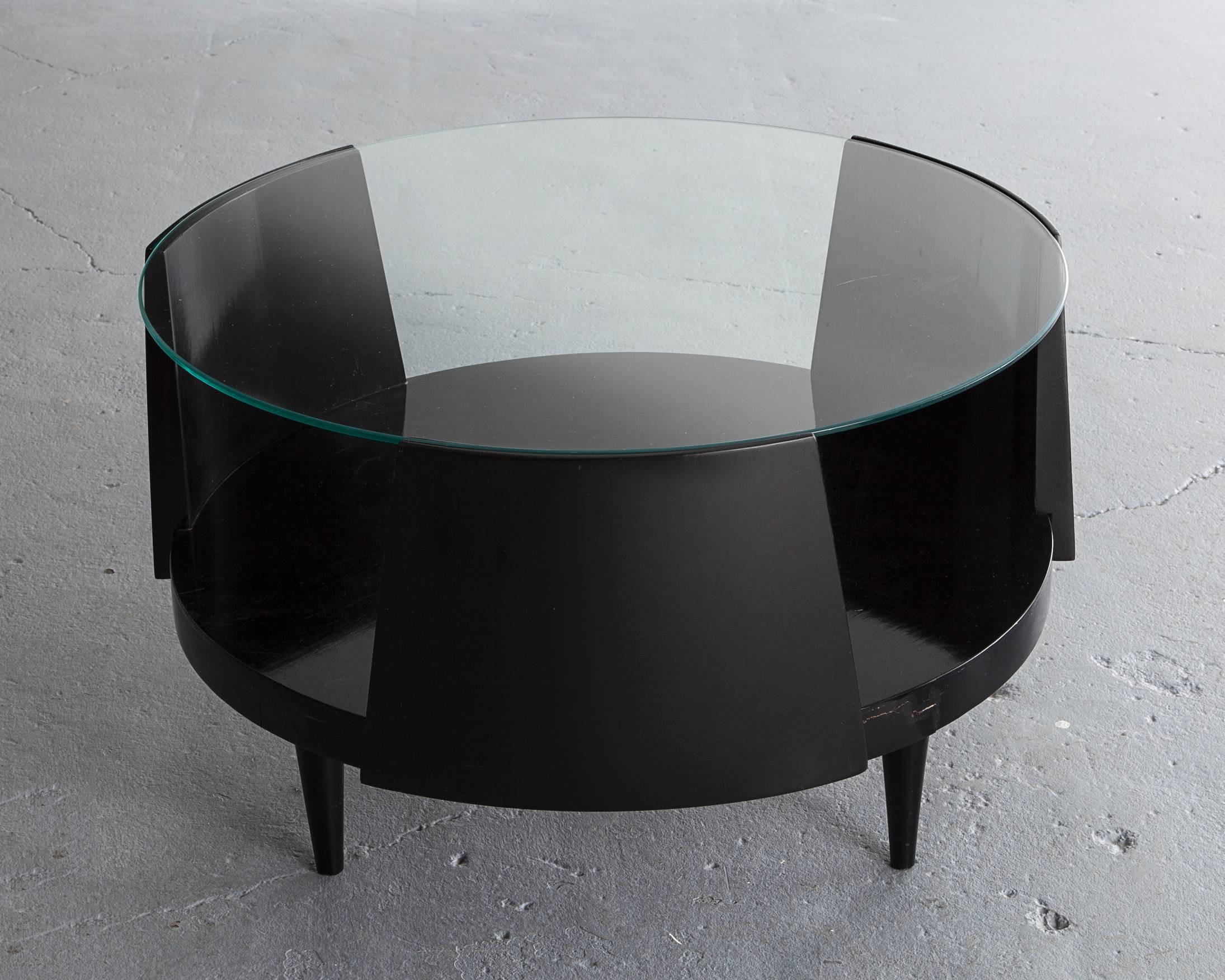 Round coffee table in ebonized wood with glass top. Designed by Martin Eisler and Susi Aczel for Forma, Brazil, 1950s.
