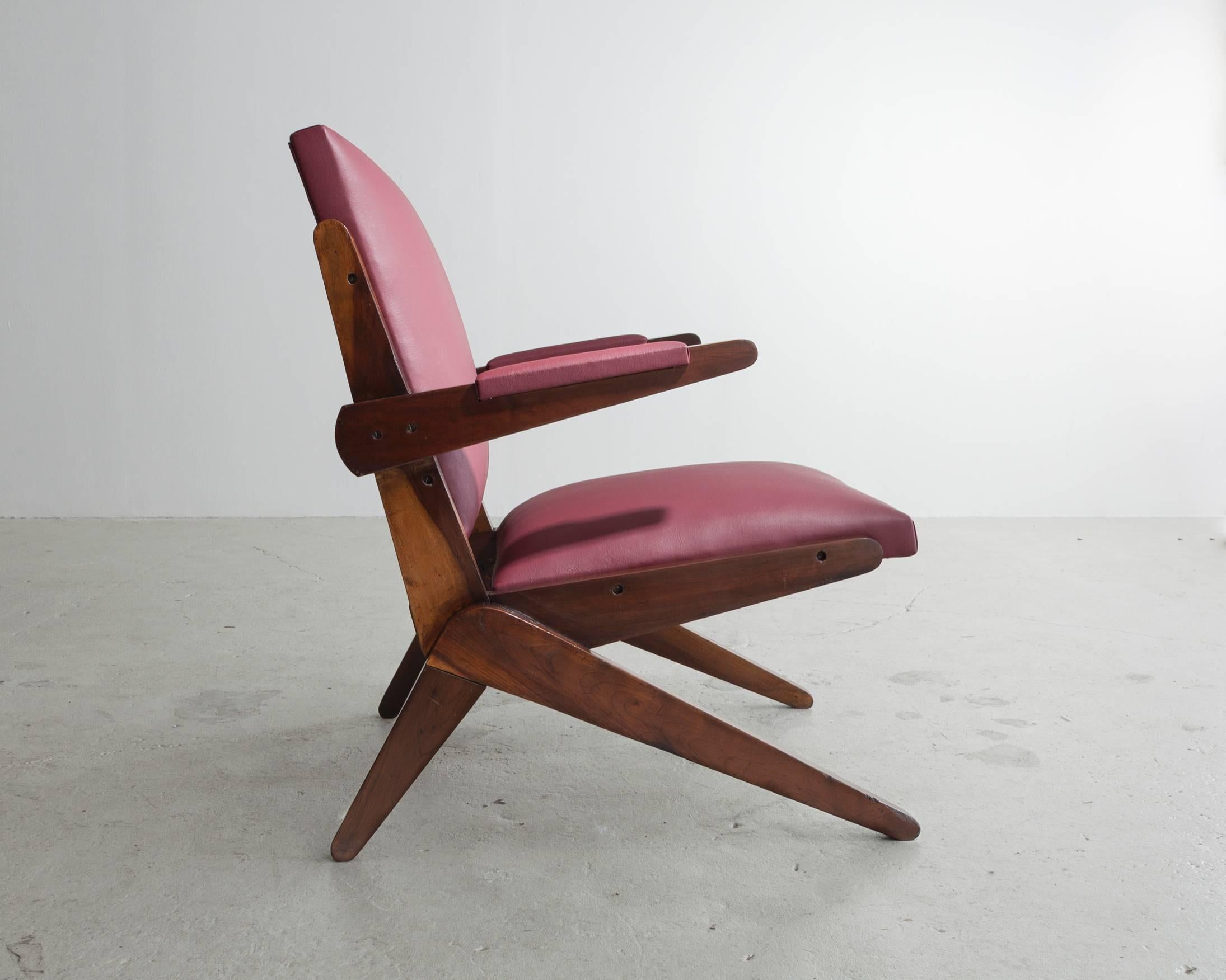 Lounge chair in wood with leather seat. Designed by Lina Bo Bardi, Brazil, 1960s. (Seat measures: 17