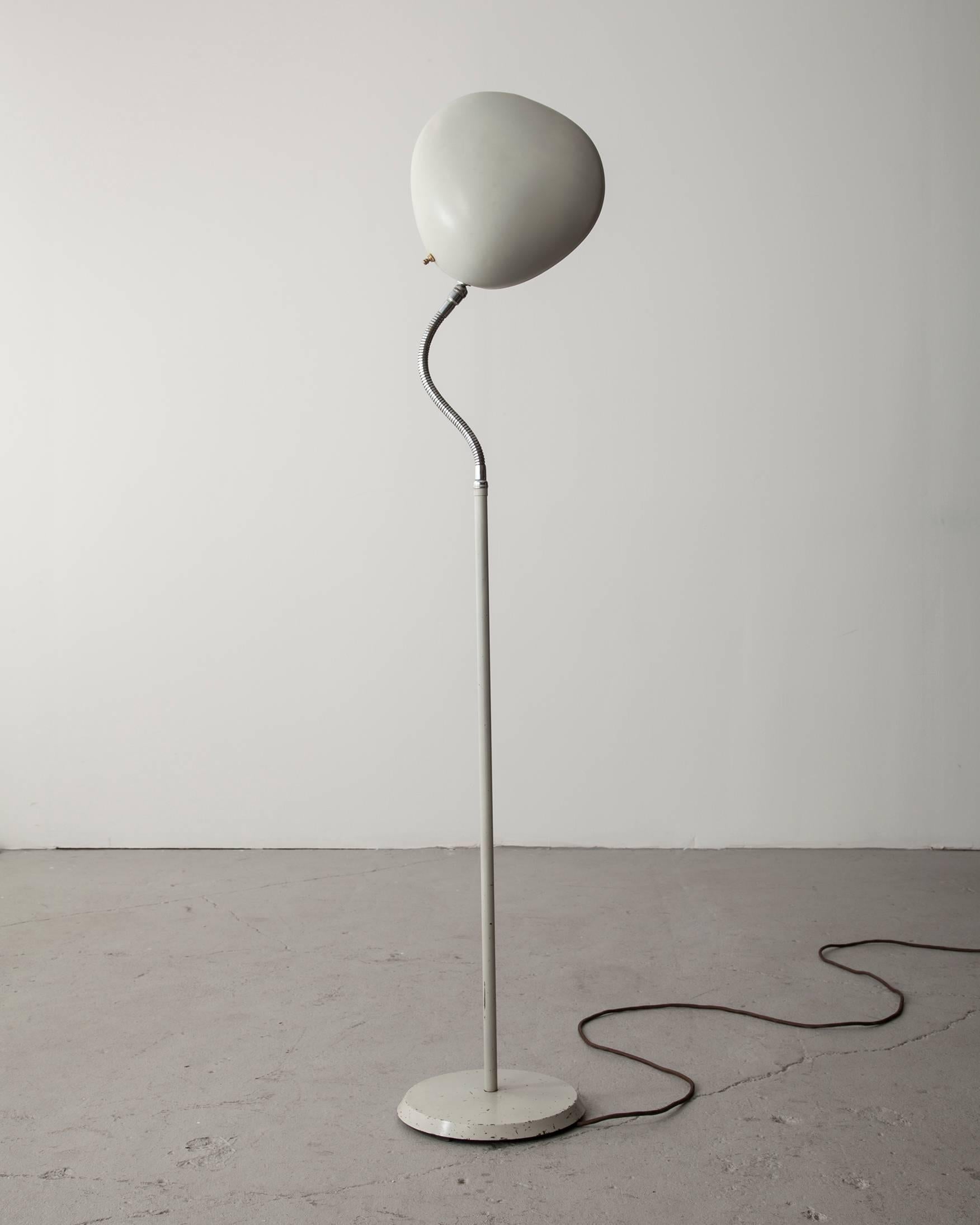 Floor lamp in white enameled aluminum on an enameled steel base with 