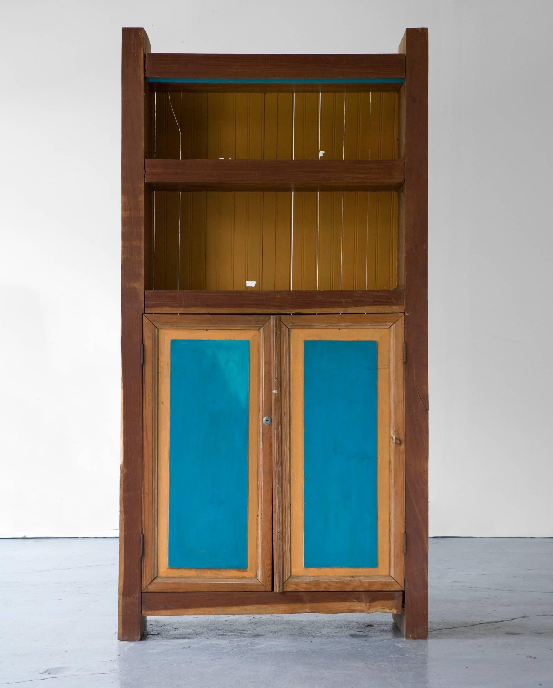 Standing buffet in wood, with painted doors and shelves in yellow and blue. Designed by Jose Zanine for Z Moveis, Denuncia, Brazil, circa 1970.