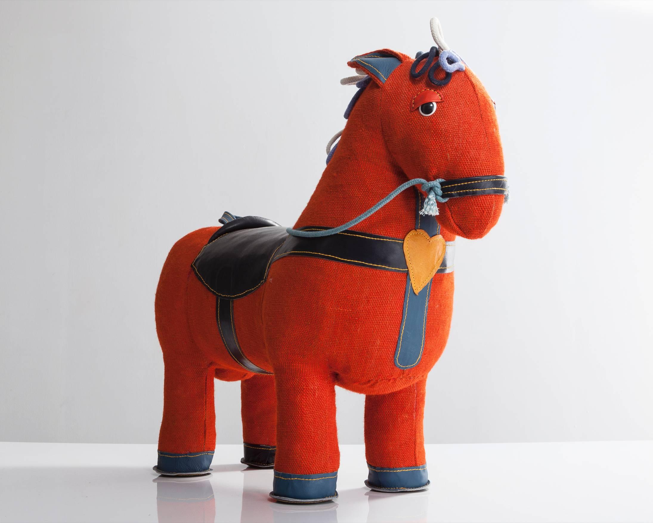 Therapeutic toy magic horse in orange jute with black leather detailing. Designed and made by Renate Müller, Germany, 2015.