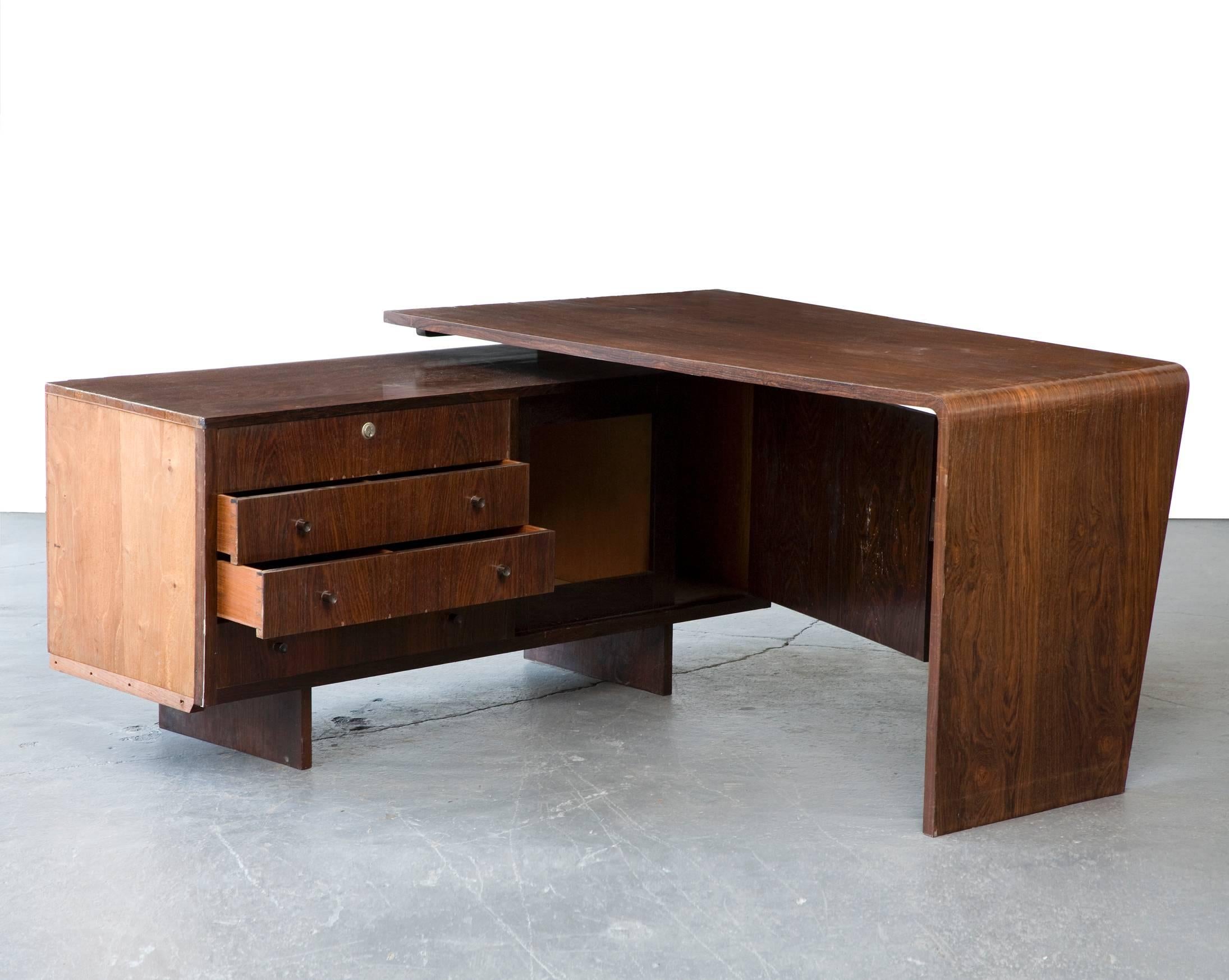 Desk in jacaranda. Designed by Joaquim Tenreiro for a private commission in the Flamengo neighborhood of Rio de Janeiro, Brazil, 1950s.