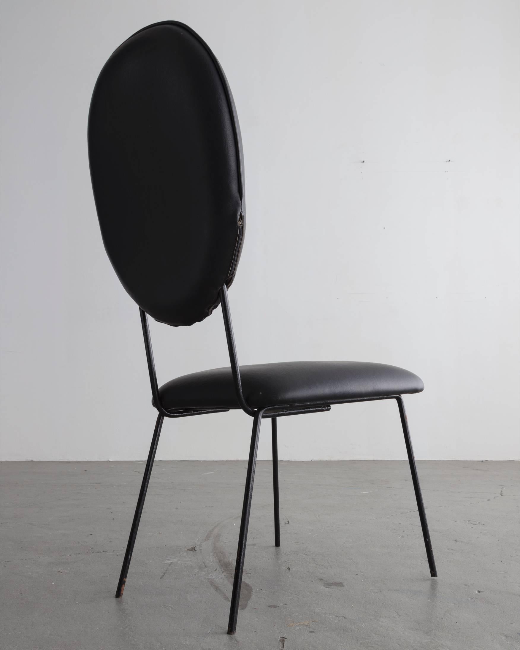 Set of six chairs with black upholstered seat and back and black wrought iron legs. Designed by Joaquim Tenreiro, Brazil, circa 1958.