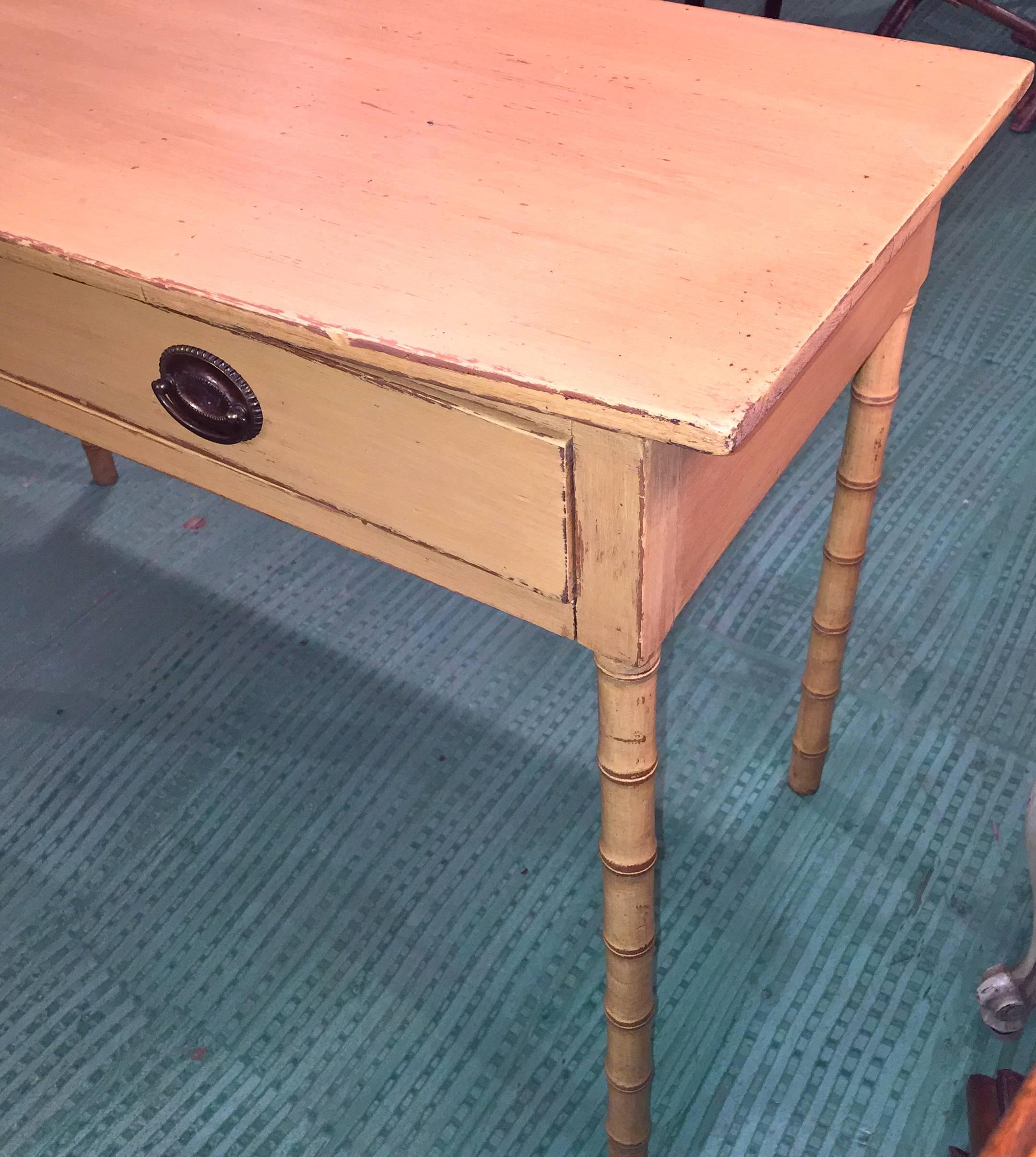 English 19th century painted bow front table with bamboo carved legs.