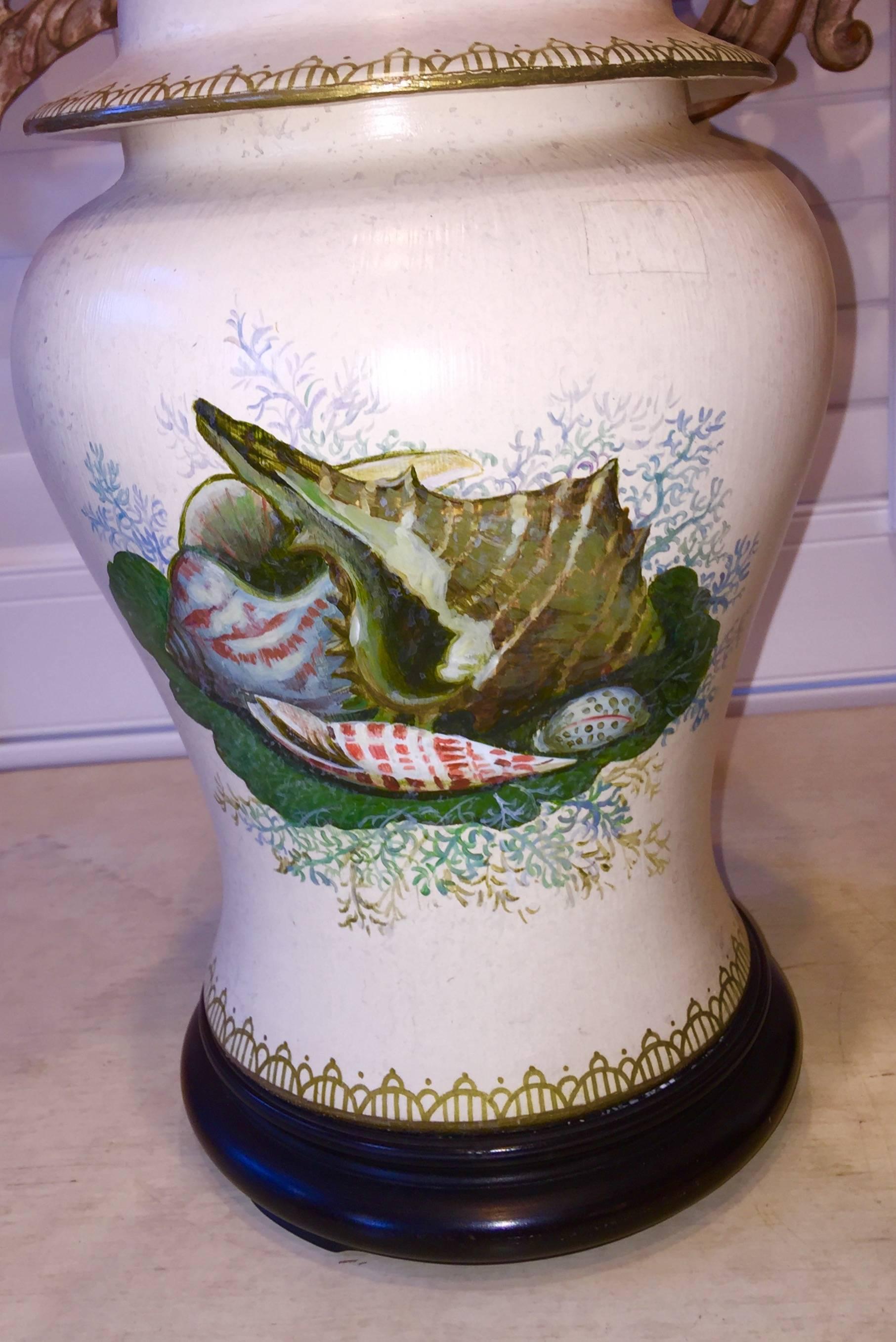 Pair of American hand-painted with shells porcelain temple jar lamps.
    
