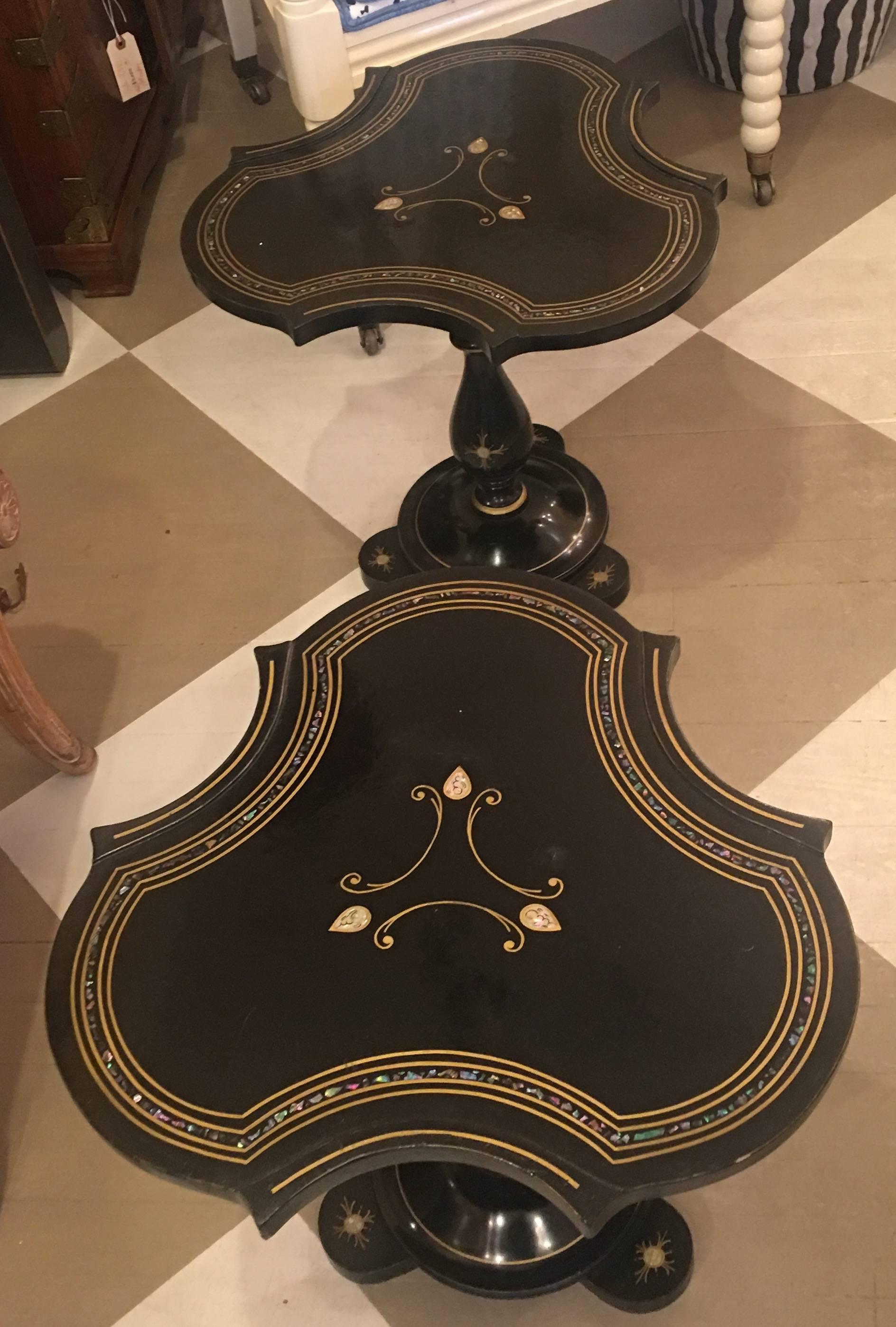 Pair of 19th century French Napoleon III black lacquered mother-of-pearl tables.