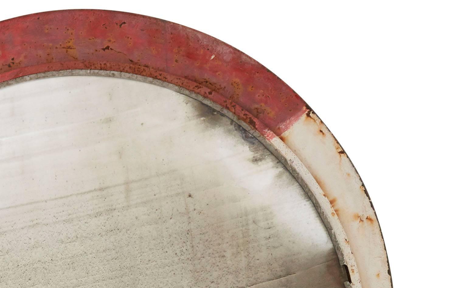 Original convex round mirror.
Iron frame with patinated paint.
Used on winding highway roads,
20th century,
France.
Measures: 54" diameter x 8" D.