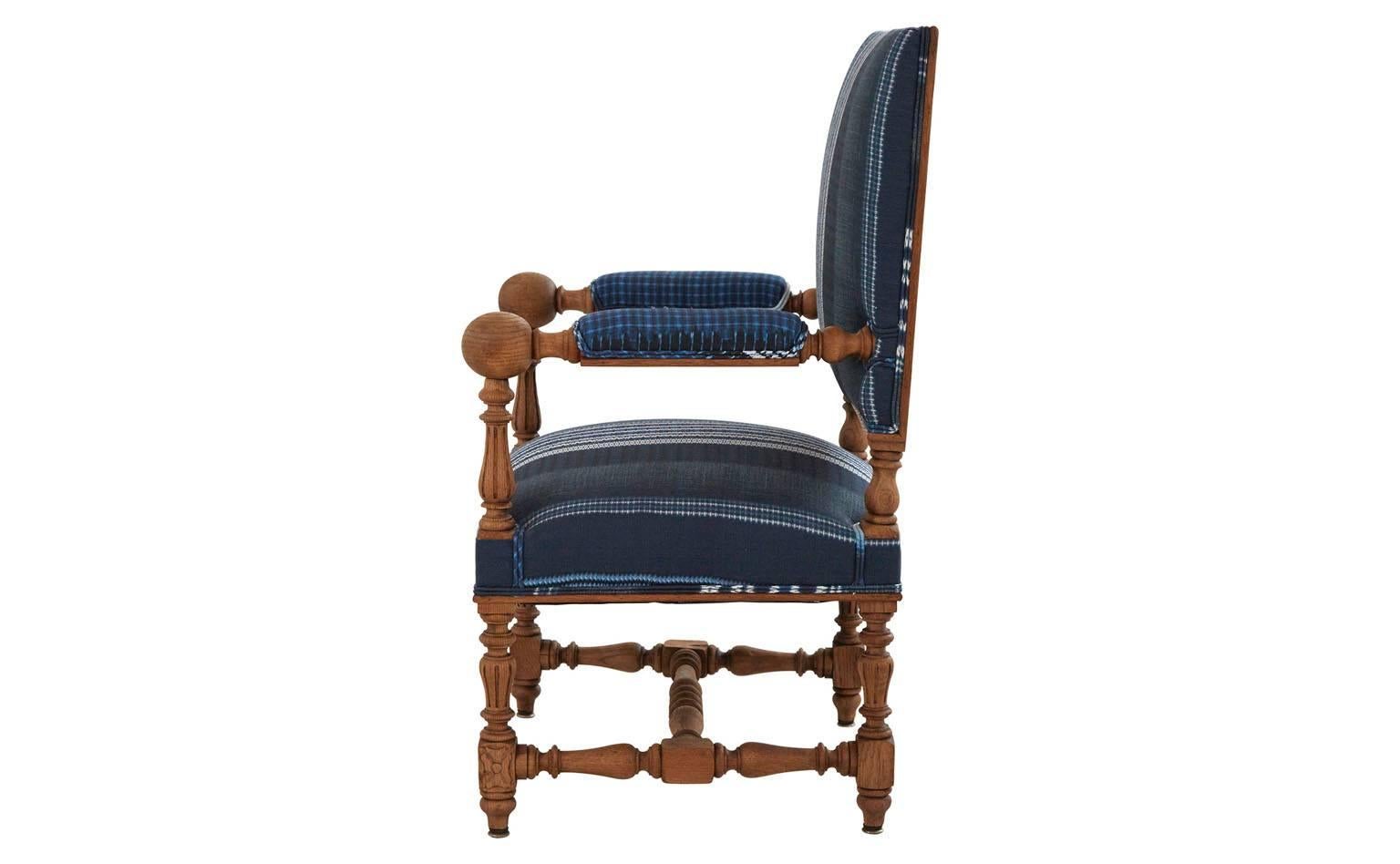 Reupholstered in festival stripe indigo linen.
Stripped wood frame.
20th century.
France.

Dimensions:
Overall: 22'D x 26.5'W x 42.5'H
Seat height: 18'H
Arm height: 28'H