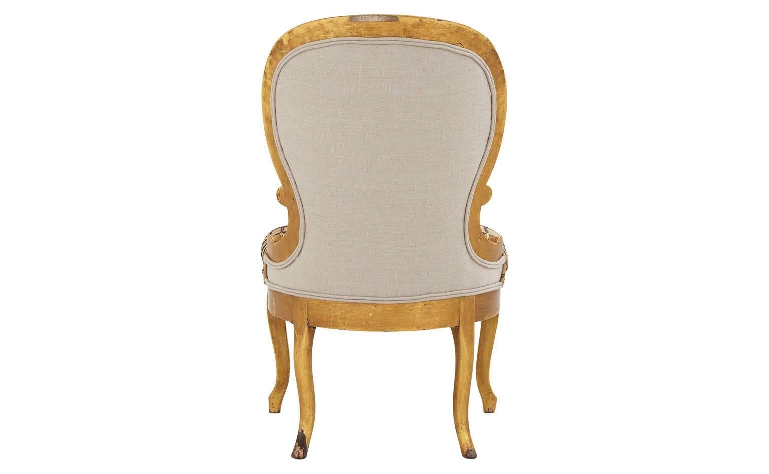 Reupholstered in kuba cloth.
Hand-carved giltwood frame.
19th century.
France.

Dimensions: 
Overall: 19