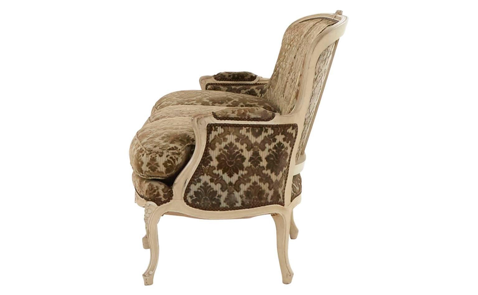 Original cut velvet upholstery.
Hand-carved Louis XV style wood frame.
Ivory laquer.
Antiqued nailhead,
20th century,
France.

Dimensions:
Overall: 70.5" W x 30" D x 35.5" H, 
seat height 18" H,
arm height 30.5"H.