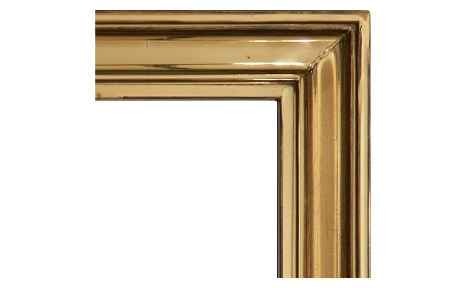 Measures: 21.25" W x 2" D x 28.25" H. 
Original mirror,
brass frame,
20th century,
Barcelona.