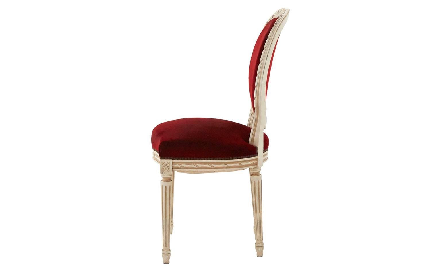 Side chair in the style of Louis XVI
Hand-painted ivory frame
Antiqued nailhead
Original merlot velvet
20th century
France

Dimensions:
Overall 20'W x 18'D x 37.5'H
Seat height 19.5'H