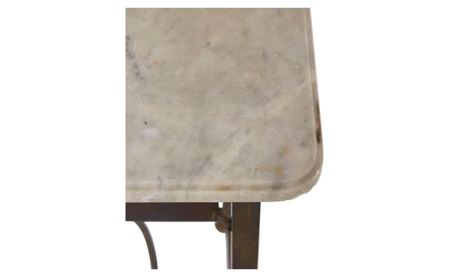 Original marble-top and brass base
Original attached mirror
20th century
France

Dimensions:
vanity: 35.5