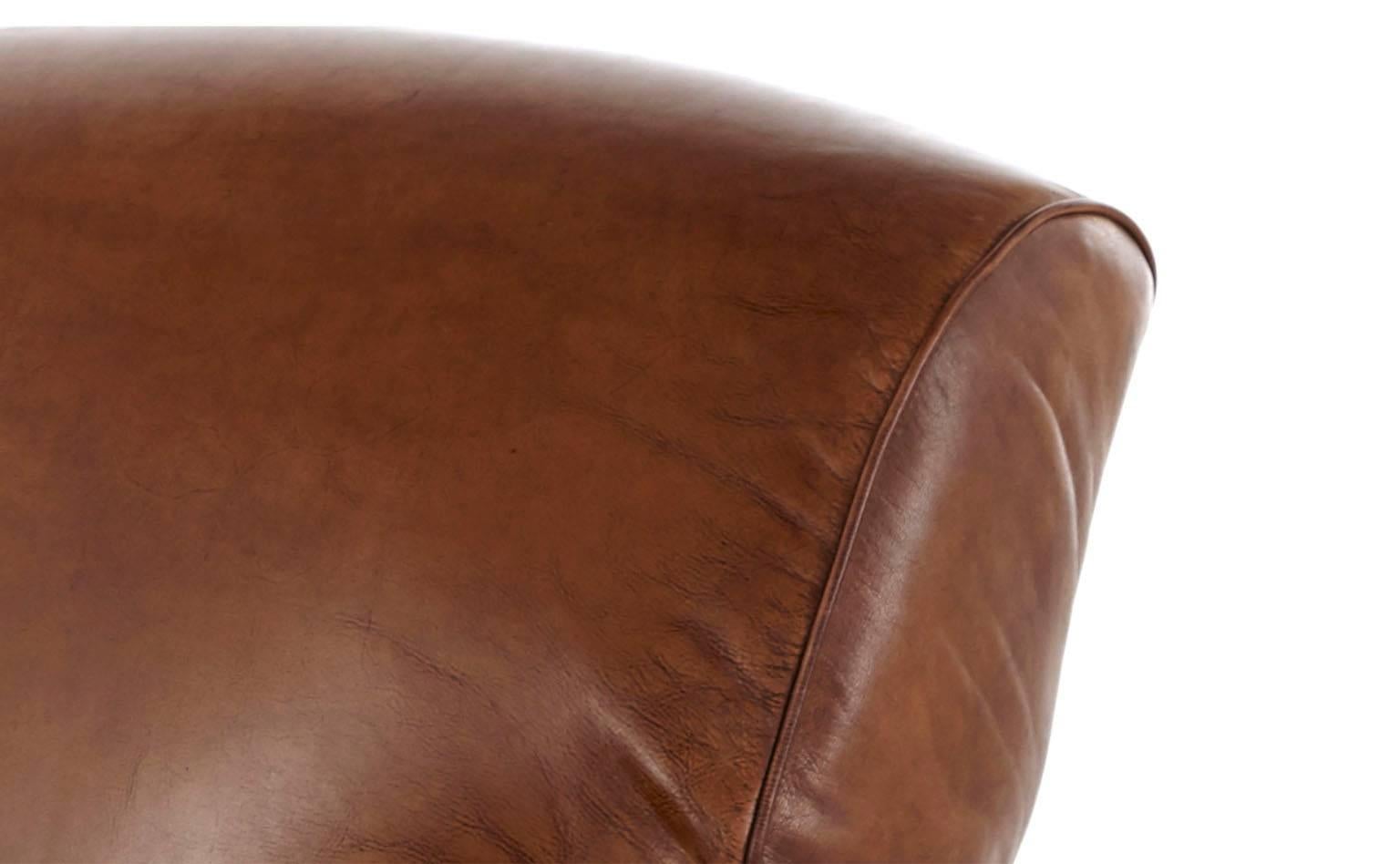 Upholstered in antiqued leather, our Dubose chair has the time-worn look and feel of a vintage French club chair. Its classic styling, plus down and feather cushion makes Dubose a great choice for the living room or den. We love this chair in pairs,