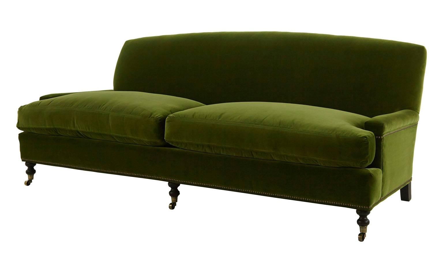 Upholstered in Marco-jade velvet.
Fabric content: 100% cotton.
Black walnut wood finish.
Antique brass nailheads. 
Antique brass casters.
Includes down and feather cushion upgrade.
Sustainable construction.

Dimensions
overall: 88