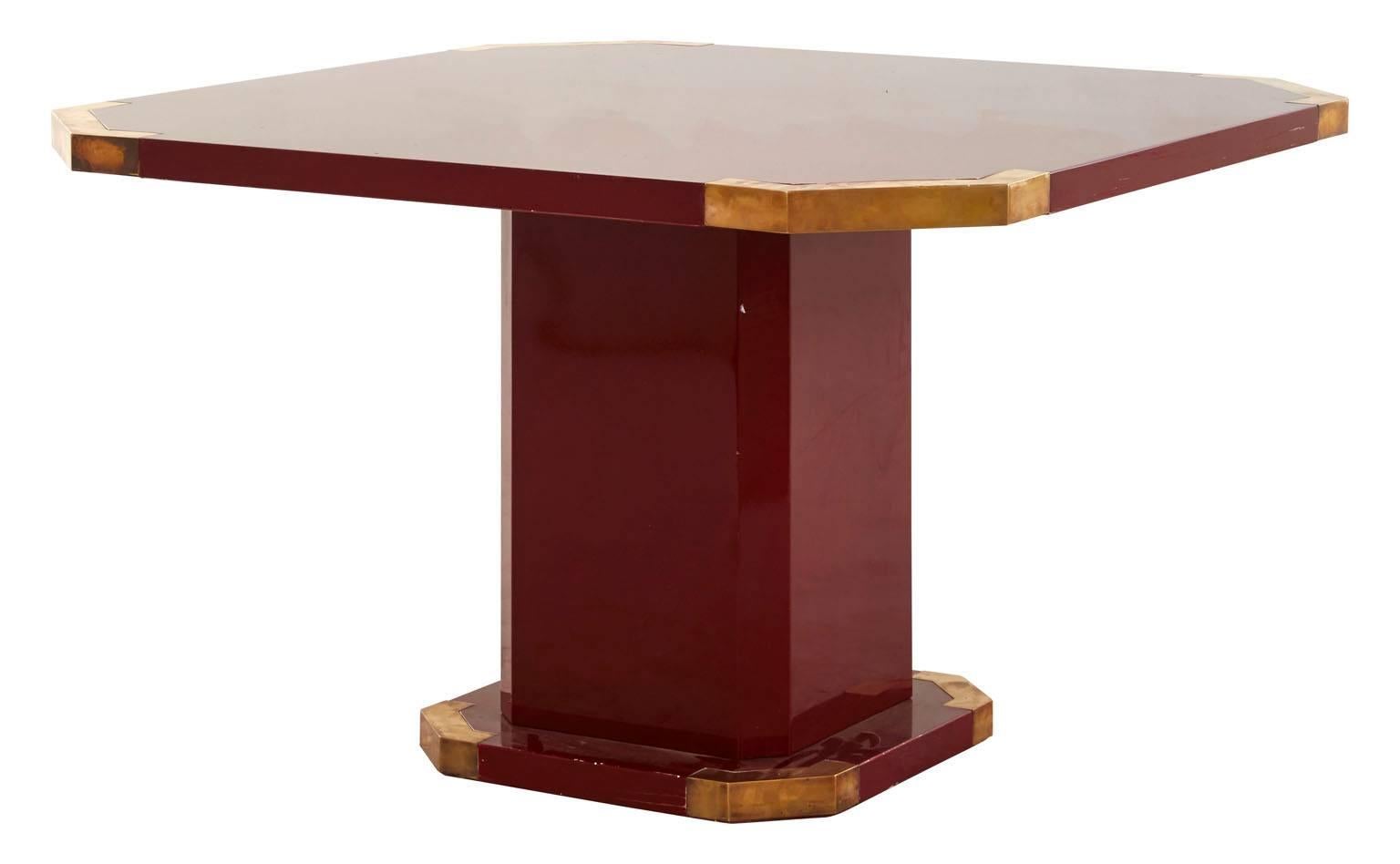 Vintage Campaign table. Original red lacquer finish. Brass details.