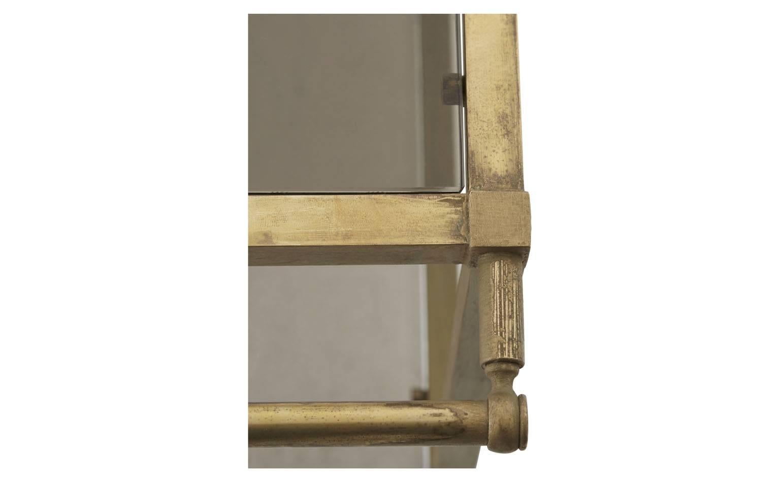 • Brass frame
• Smoked glass
• Brass casters
• 20th century
• Spanish
• Measure: 16.5 D x 29.25 W x 24.25 H. 


