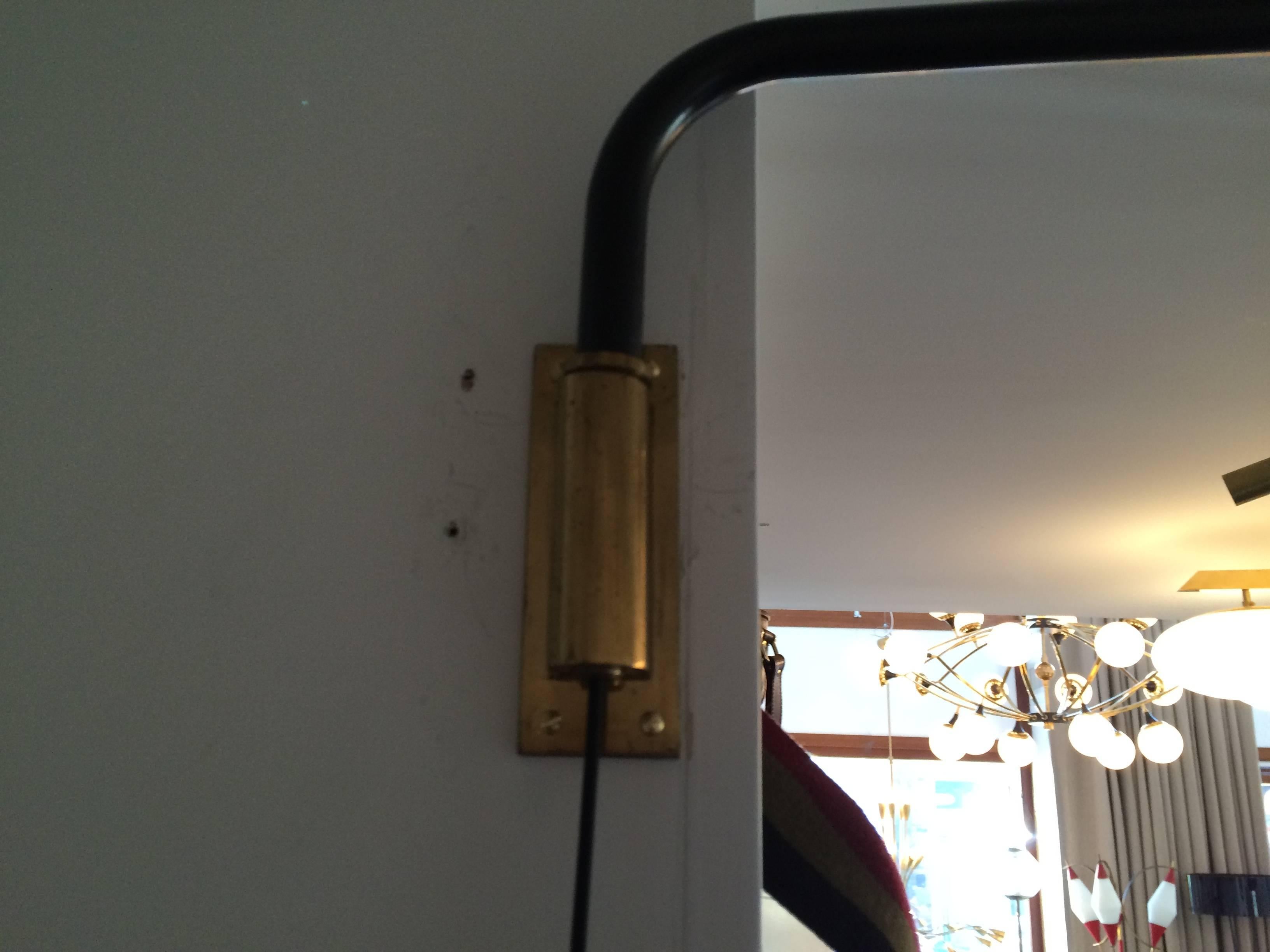 All brass fittings with black enameled telescopic (adjustable)
arm that swivels 180 degrees. Can be mounted at any height.
Linen shade pendant is also adjustable. Very flexible design.
Has been rewired with step on floor switch, circa 1960.
 