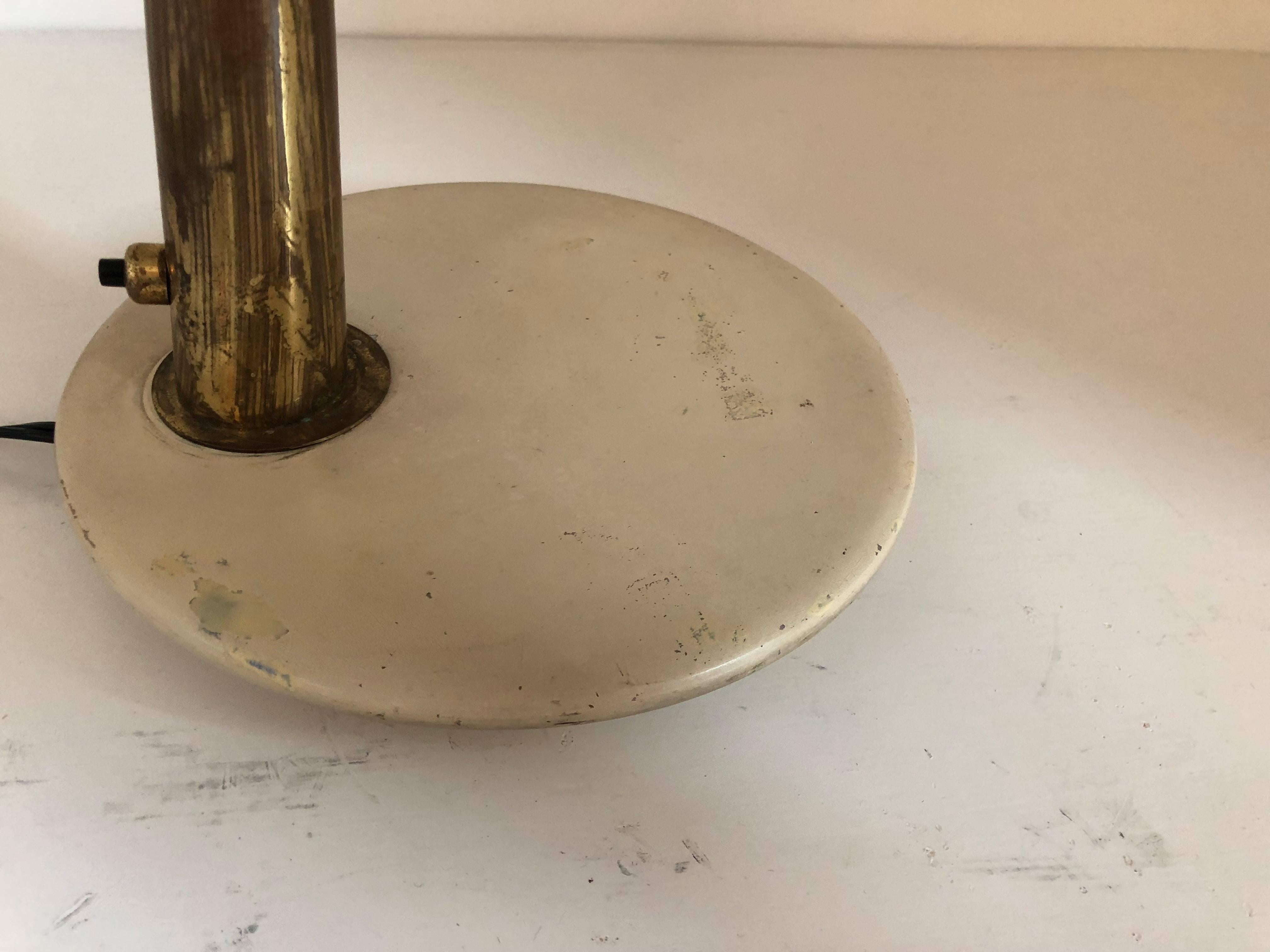Italian task lamp designed by Giuseppe Ostuni for O-Luce. 
Brass lamp on marble base with enameled metal shade.  
All original. Newly rewired. This lamp can be completely restored upon request.