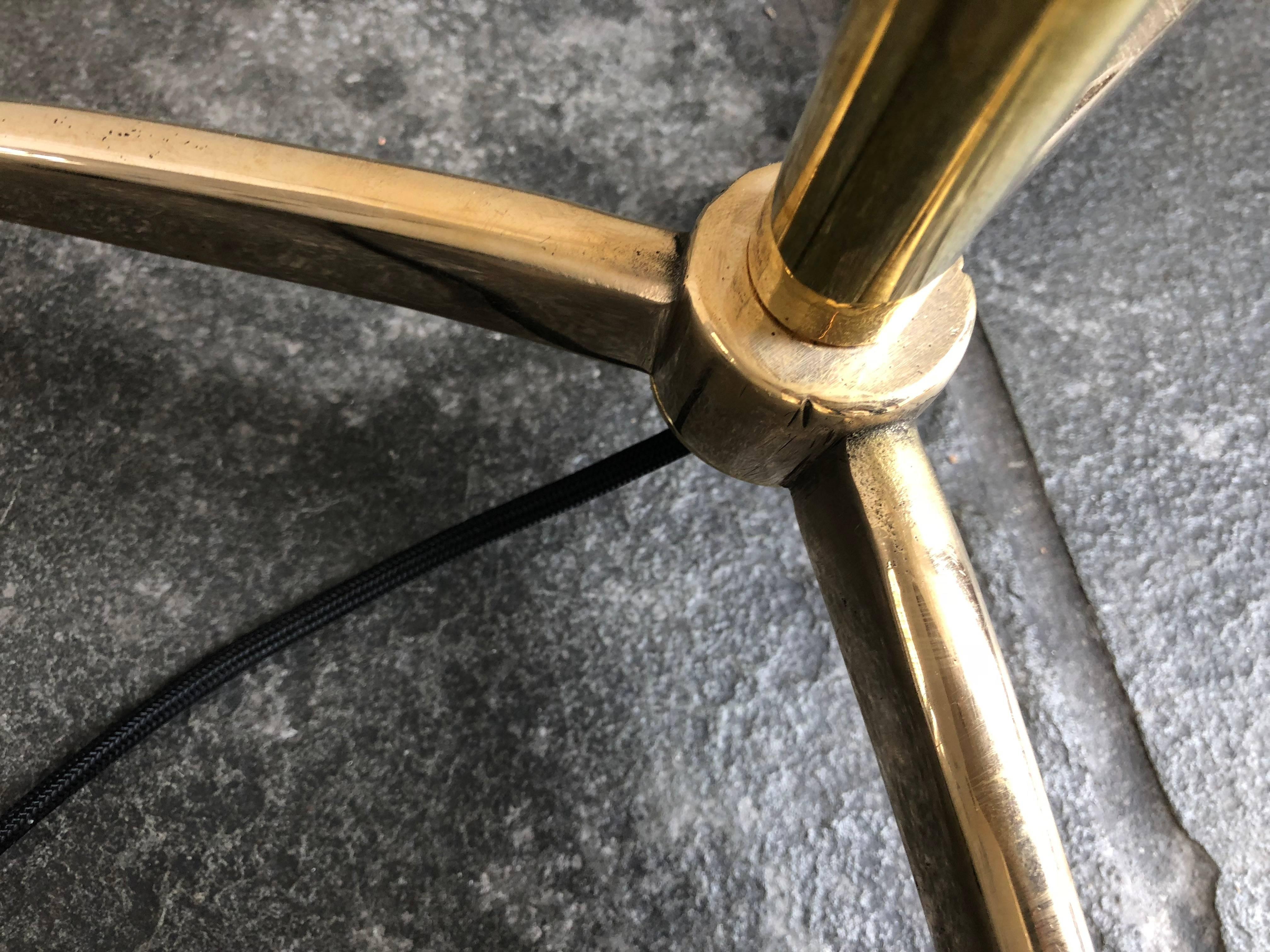 Brass column floor lamp on tripod base in the style of Stilnovo the mid-century masters of modern design.  With chain pull.  Custom sizes and finishes available.  Shade not included.  Made in Italy.

