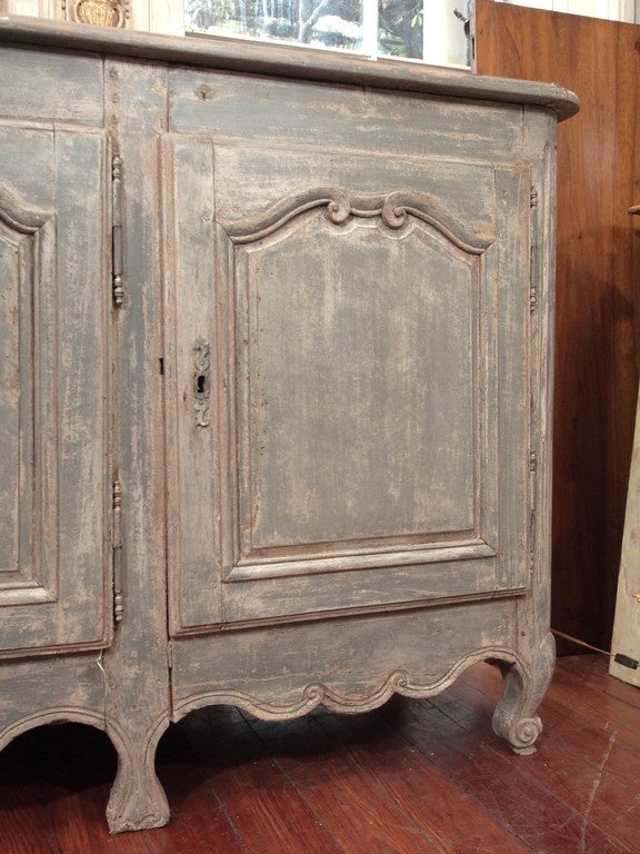 Louis XV period 18th Century  buffet painted in pale blue/gray. 4 doors.  Loss of paint.