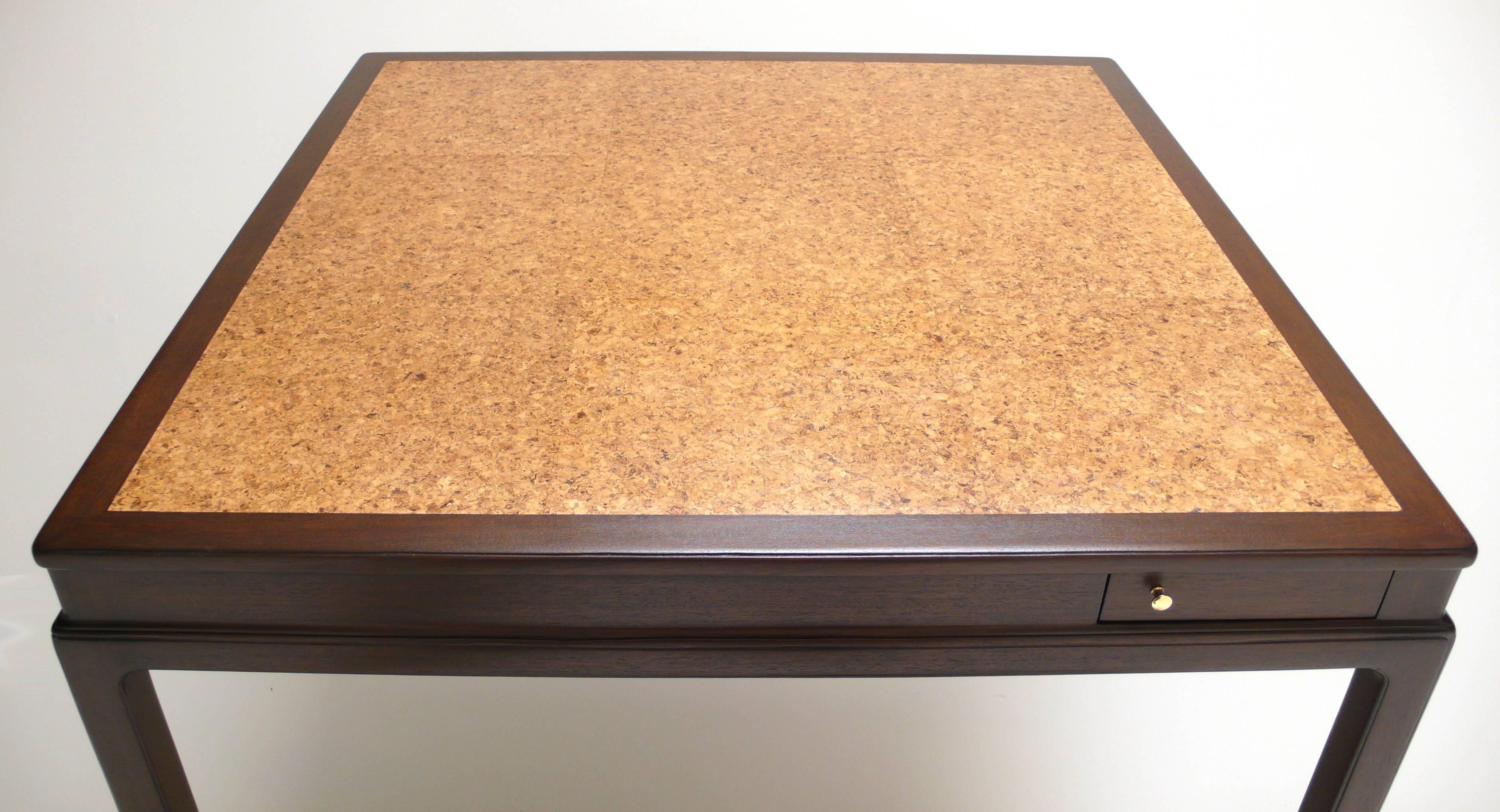 Dunbar game table with flip out coaster drawers with cork lining. The natural cork top has a new wax finish and is quite complementary to the espresso finished mahogany. An elegant piece in exceptional condition.
