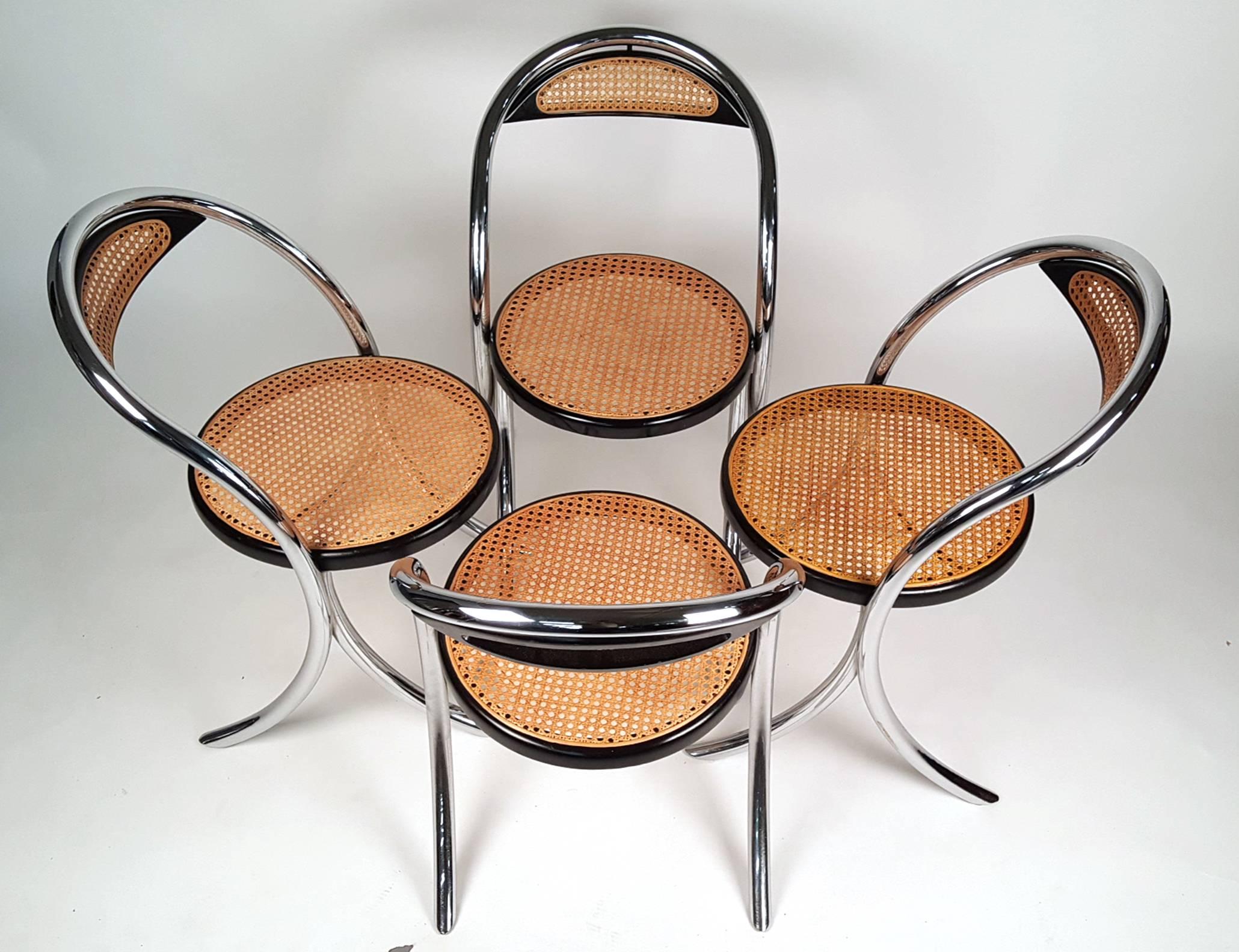 Set of four unusual Italian saber leg dining chairs. One chair retains partial 