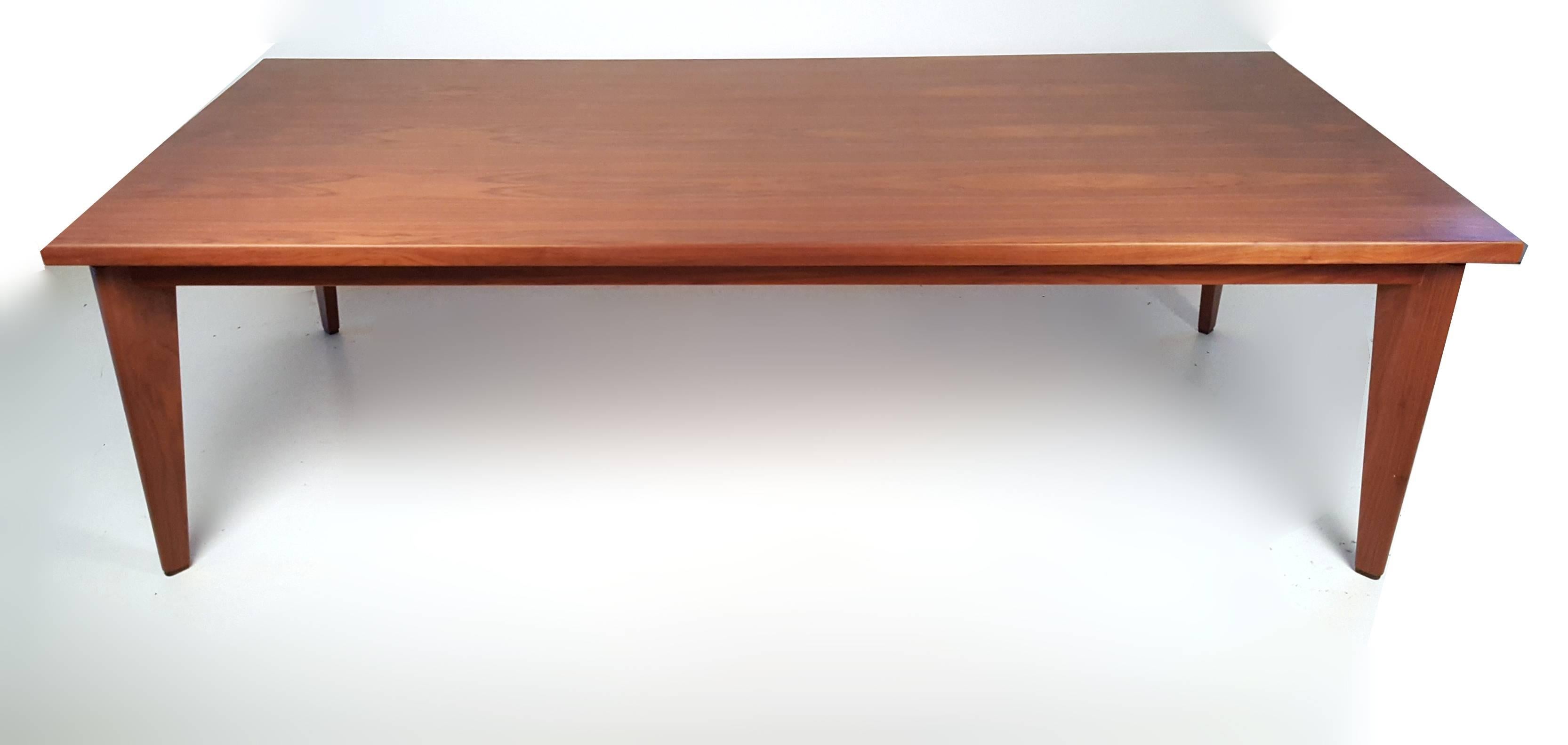 1960s custom-made table by Dallas Studio craftsman Ben Kanowsky. The table was created using solid walnut legs, a solid wood table skirt with solid wood banding around a book-matched walnut veneer top. You can certainly see the influence of Jean