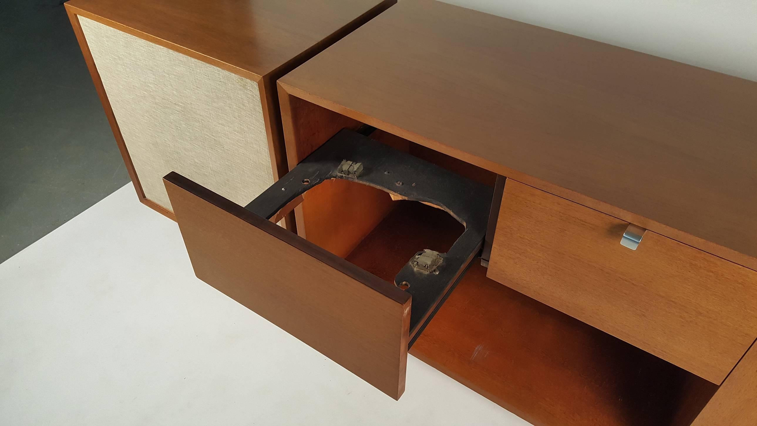 1950s George Nelson Stereo cabinet for Herman Miller with rare satellite speaker option. University speakers included. Ready to add your favorite turntable and receiver. Stereo cabinet measures 56.25 w x 18.5