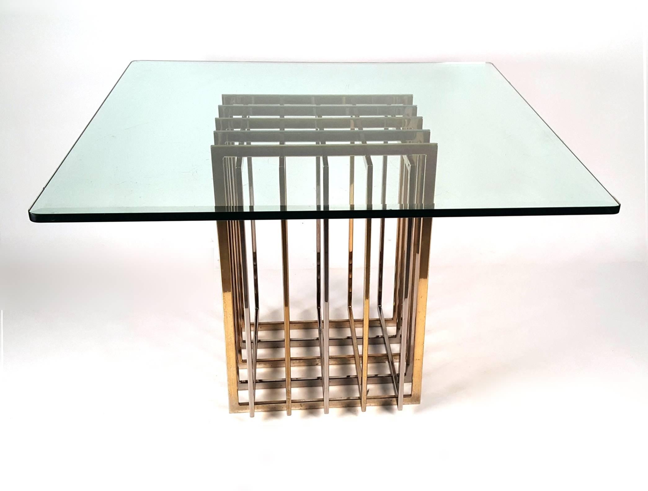Vintage 1970s Pierre Cardin mixed metal table with glass top. Top could be exchanged for a round top. The base folds in on itself so it could be used as a console with a more narrow top.