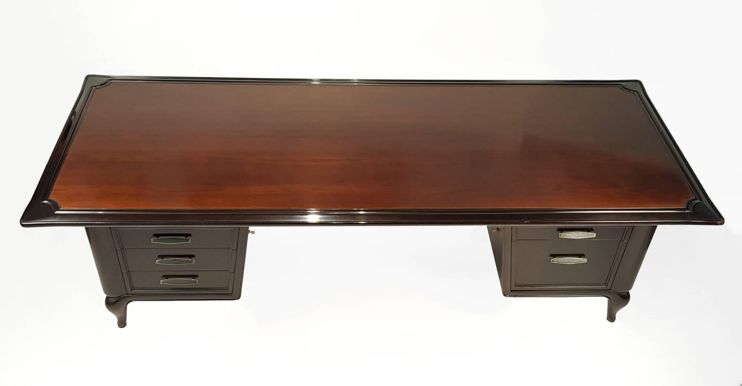Rare premier executive desk designed by Maurice Bailey for Monteverdi & Young of Los Angeles. These desks were made famous by bankers and movie executives in California throughout the 1960s. This Luxurious example was custom ordered for the private