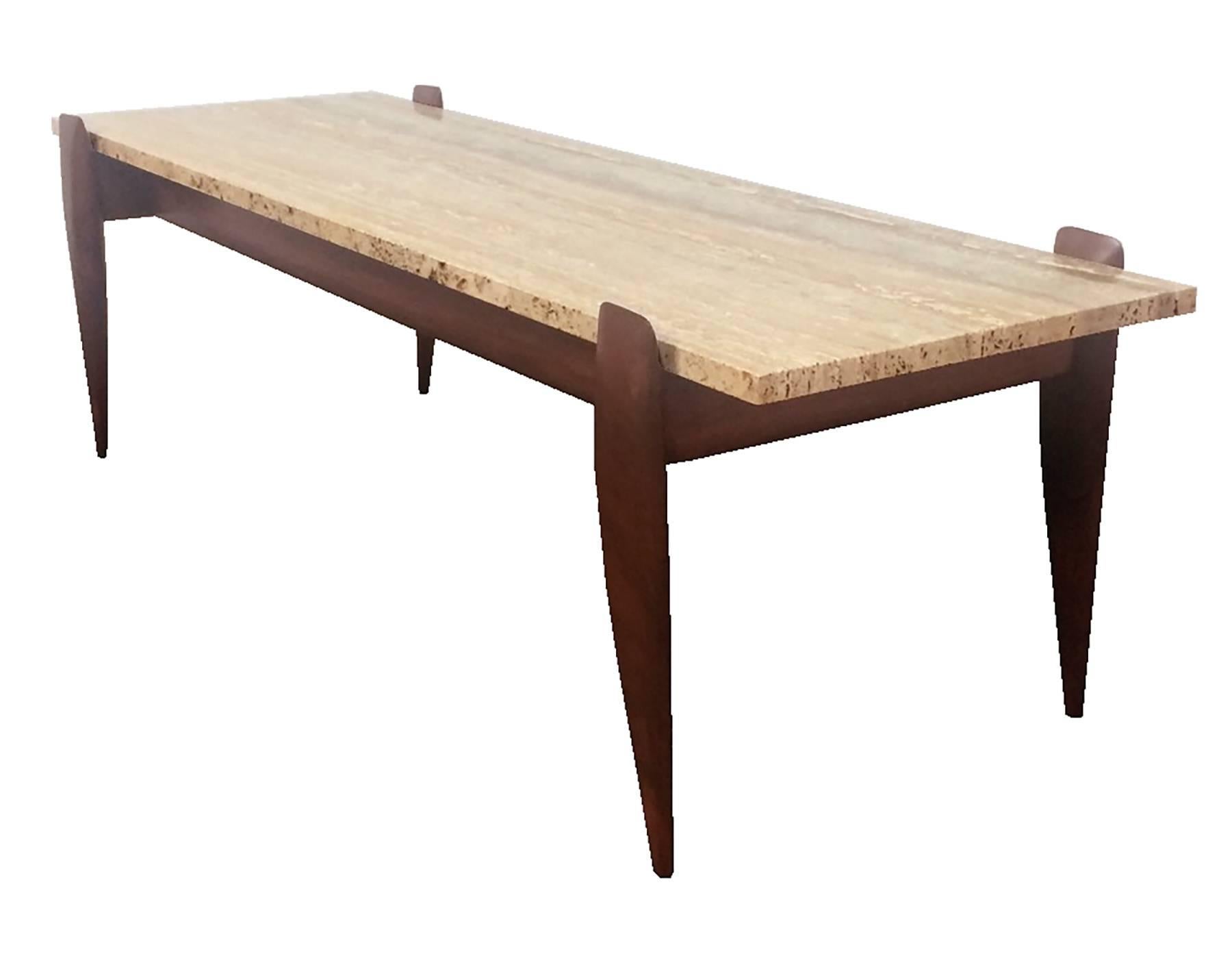 Iconic sculpted walnut Gio Ponti cocktail table with a floating travertine top. Original M. Singer & Sons label intact. The table is currently located in NYC.