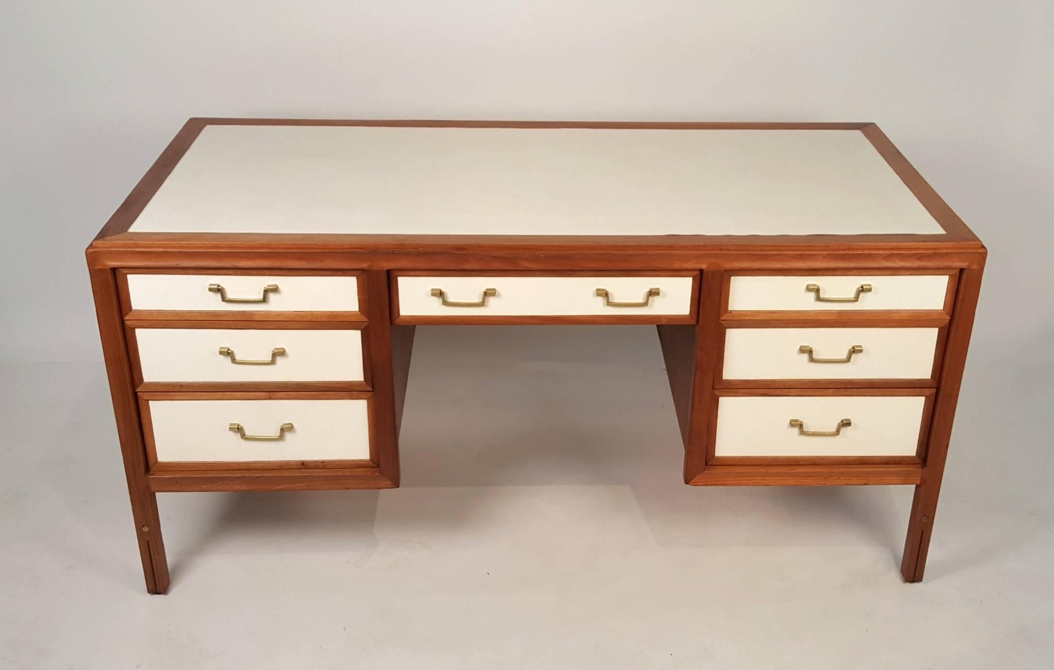 Unusual walnut campaign desk with leather top and drawers by Gerry Zanck for Gregori. Solid brass hardware. Solid scalloped walnut frame. Original leather in very good condition.