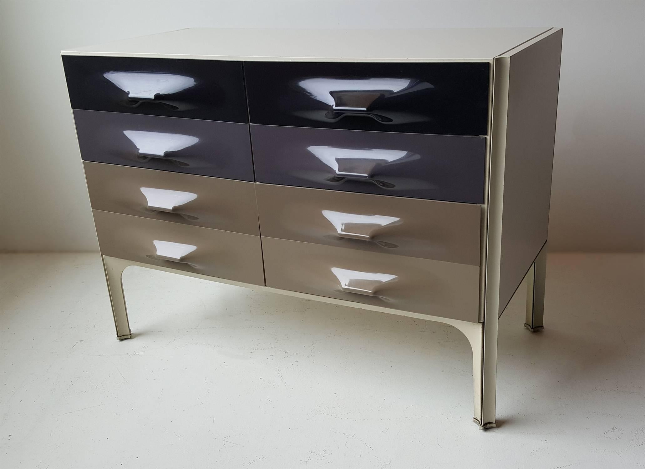 Futuristic DF-2000 chest of drawers designed by the father of 20th century Industrial Design, Raymond Loewy. Six drawers total with vacuum formed plastic handles.
