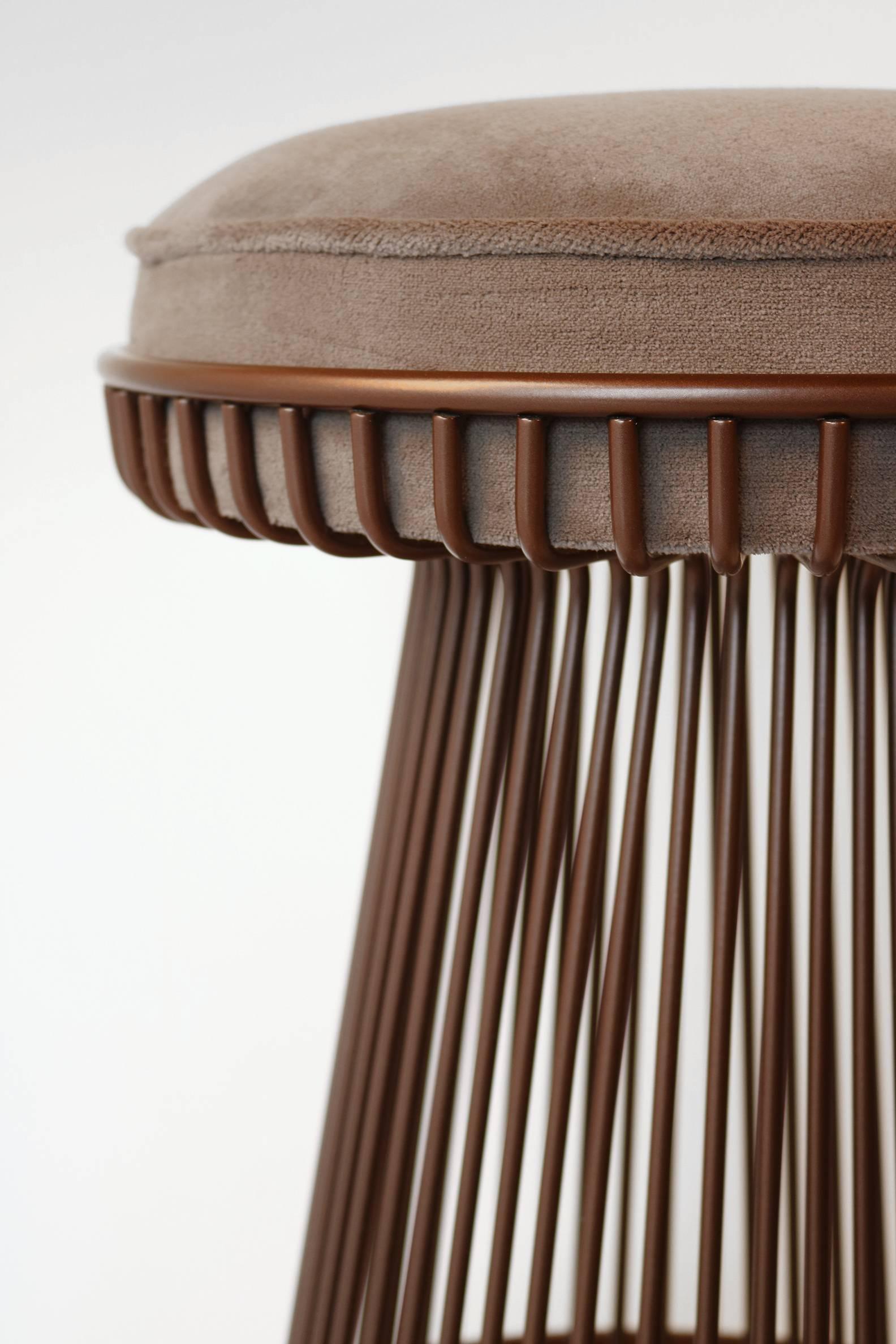 Set of three 1960s steel barstools after a design by Warren Platner for Knoll. Barstools have been sandblasted and finished in a durable, electrostatically applied, bronze thermoset polymer finish. They have been re-foamed and reupholstered in a
