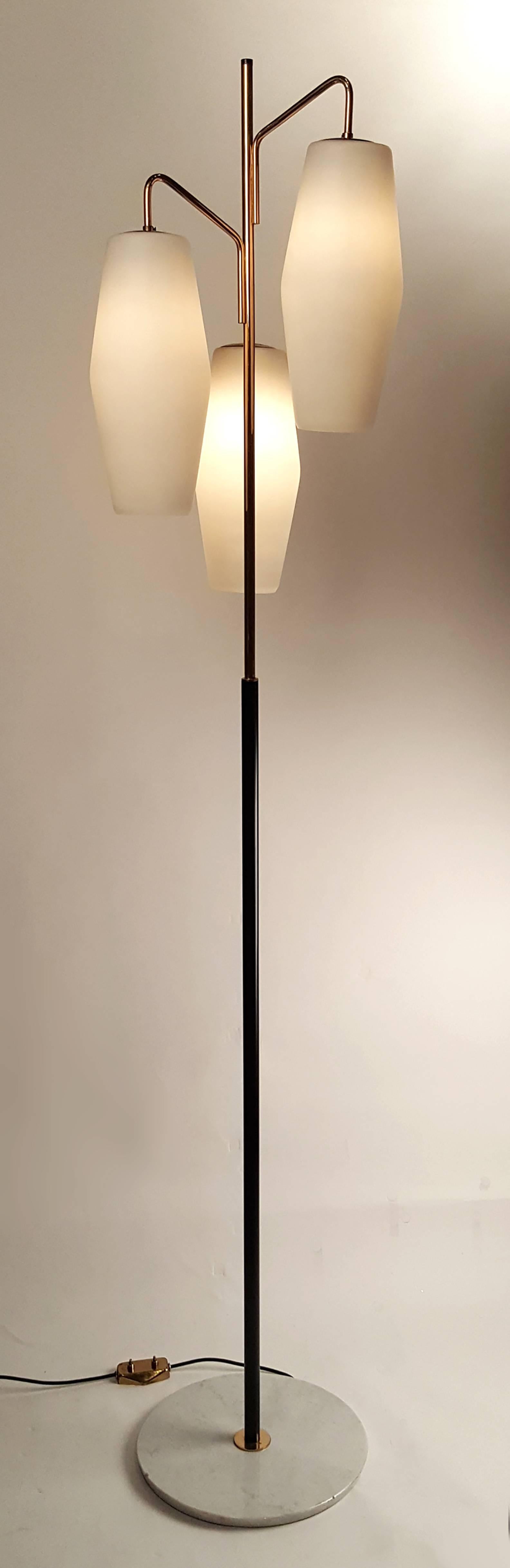 Frosted glass shades suspended on a gilt and black lacquered metal stem on a Carrara marble base with original foot switch. Stilnovo hallmark impressed into the steel to which the shades mount. Completely rewired.

Literature:
Thomas Brau¨niger,