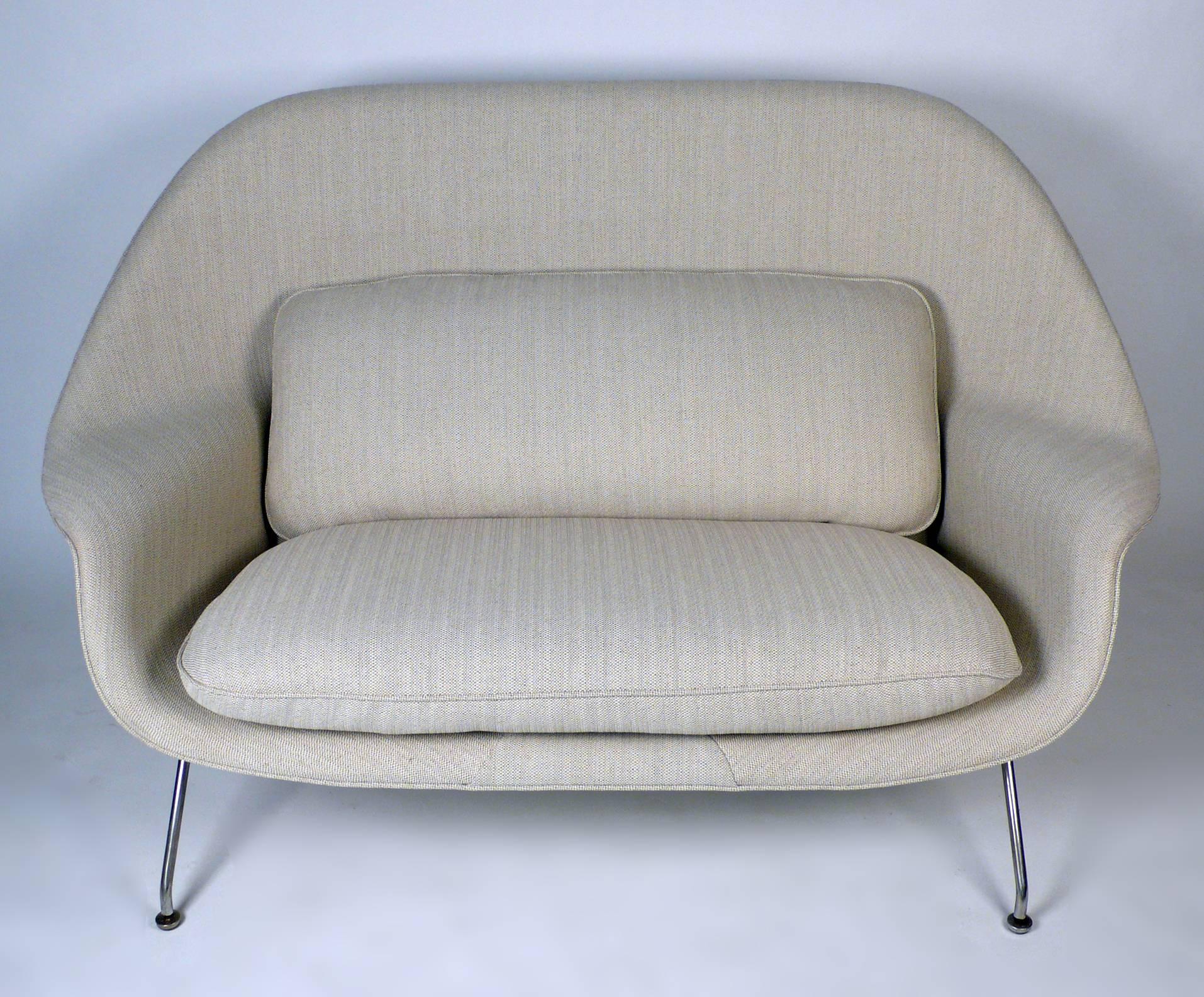 Early production womb sofa or settee designed by Eero Saarinen for Knoll, 1948. Saarinen saw this design and their necessary function as timeless. Sofa has been professionally refoamed and upholstered in a beautiful Knoll fabric. Seat height