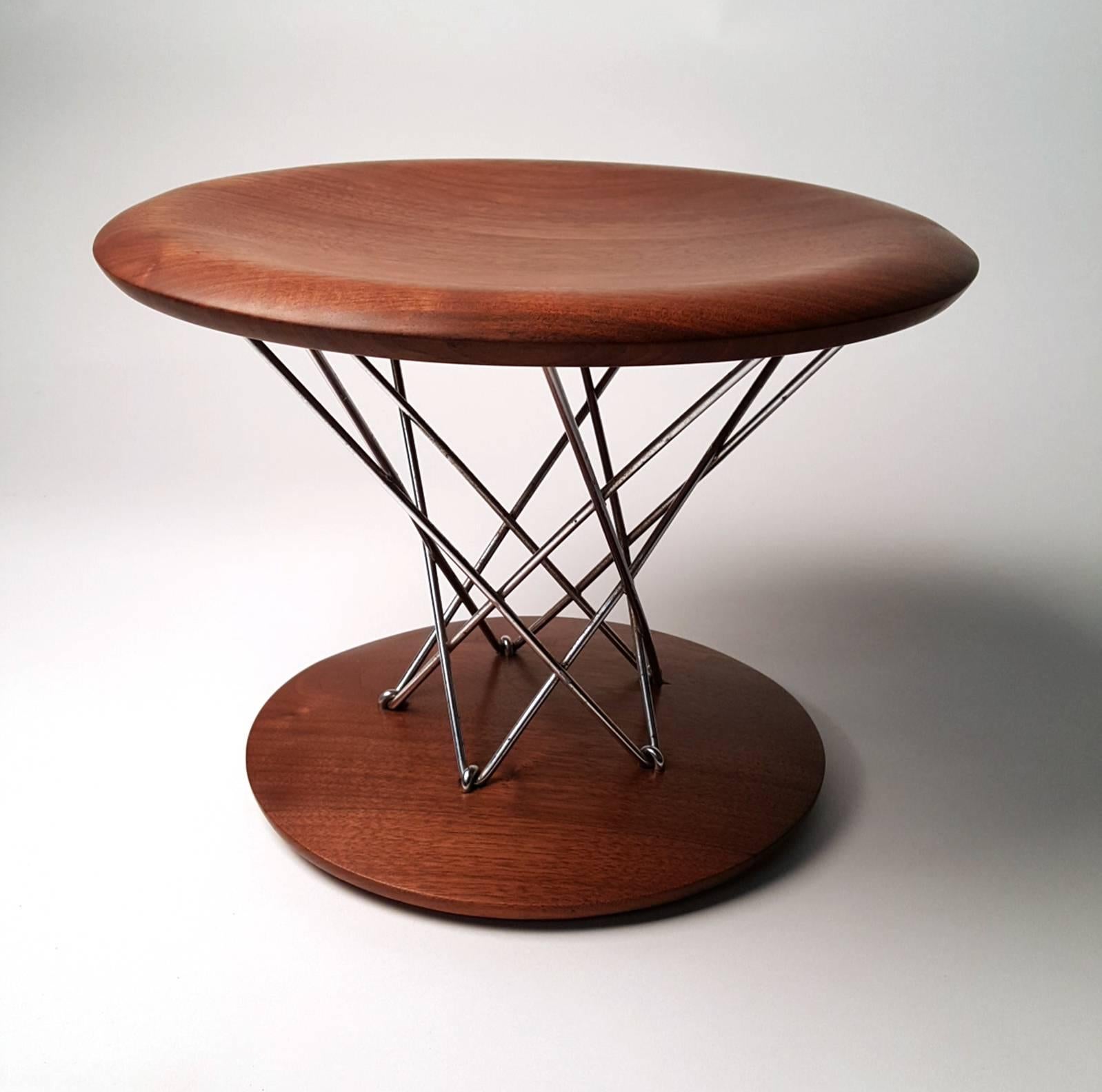 Early, solid walnut Isamu Noguchi rocking stool. Model 85-t. Produced by Knoll.