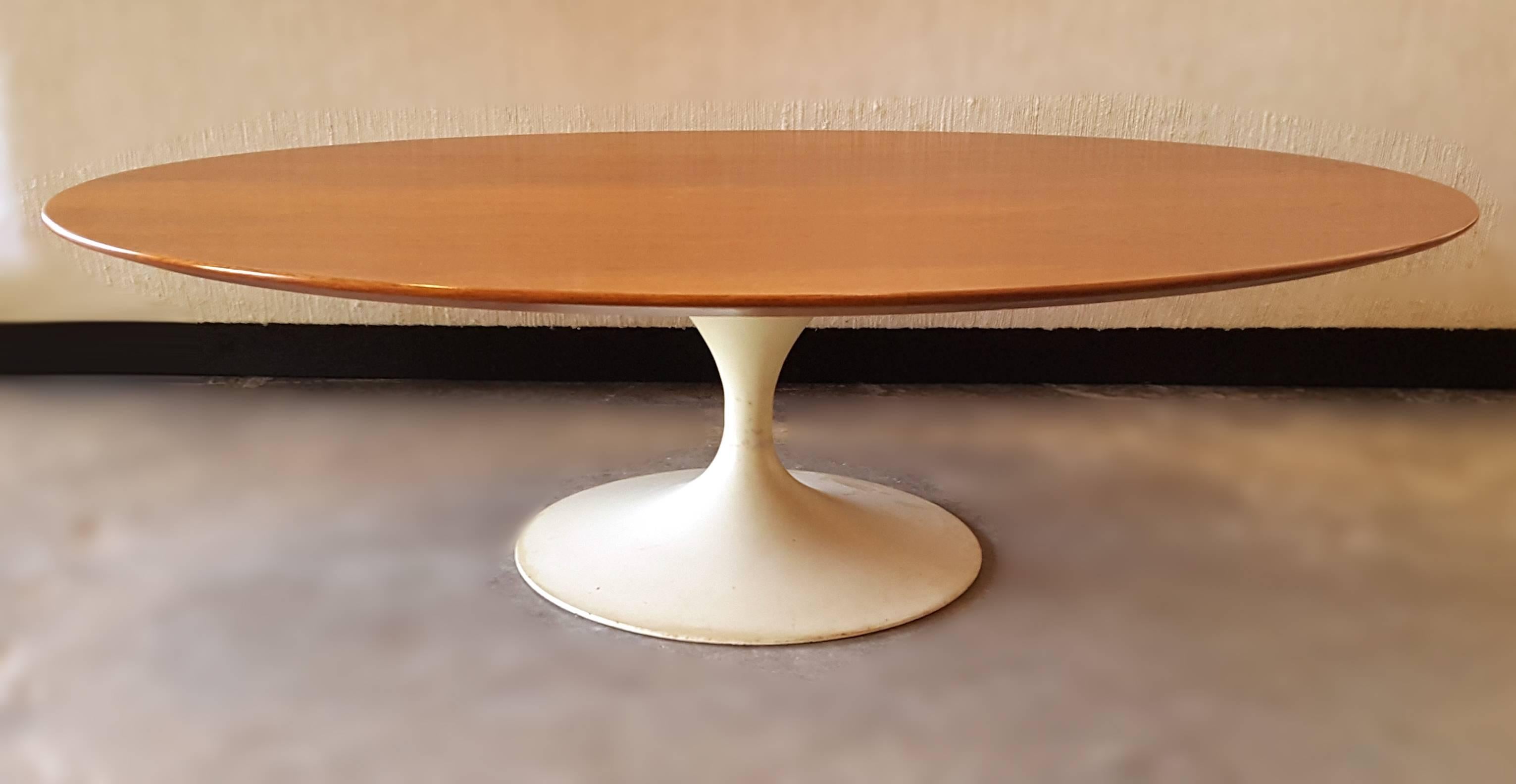 Iconic early oval Eero Saarinen coffee table for Knoll retains partial fabric label to underside. The base is unrestored and has a nice tone and patina.