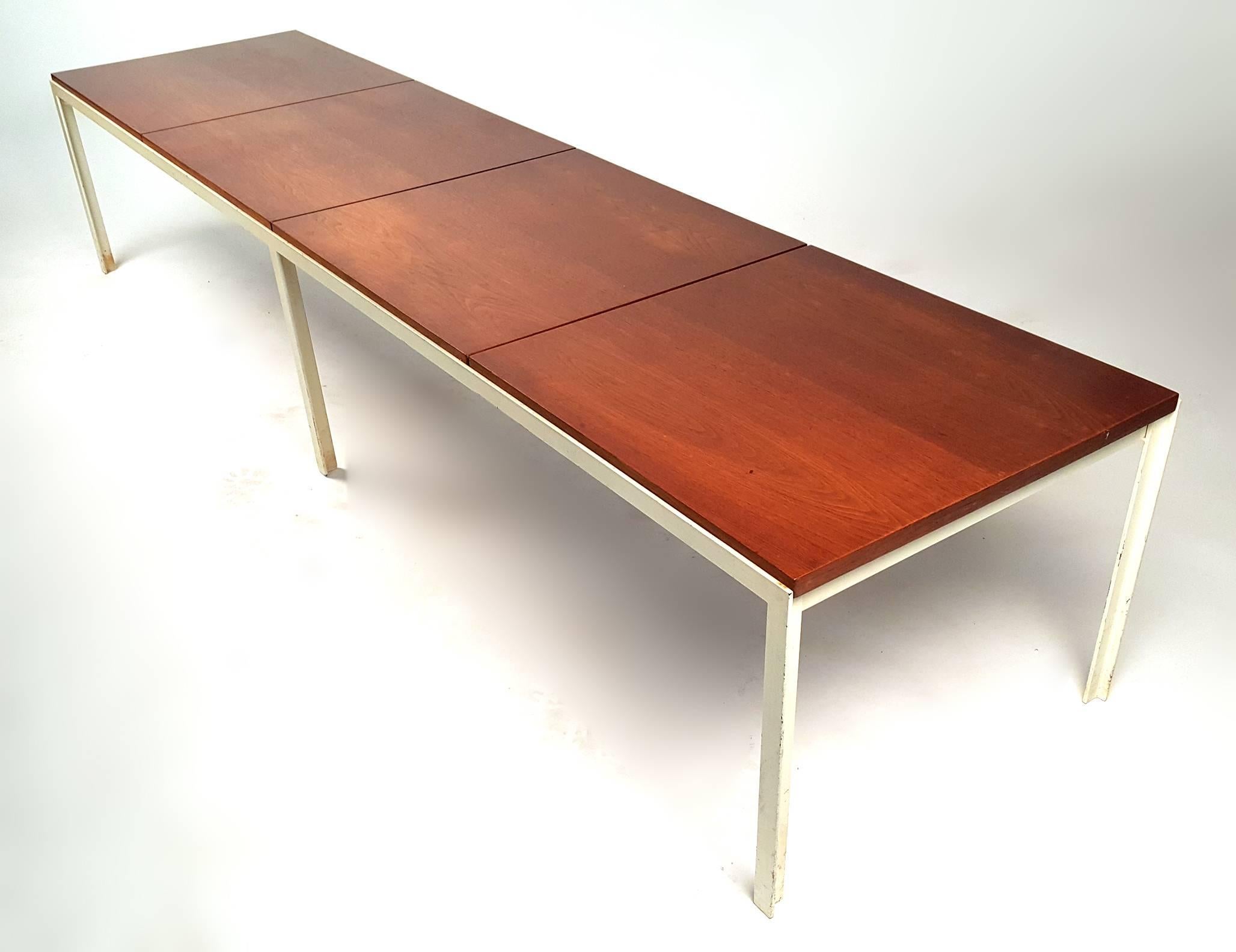 Large early production Florence Knoll angle iron and walnut table or bench with segmented walnut top from the 'T-Angle' Series. This is a very substantial piece and would easily support the weight of four large people. Retains original label. 

We