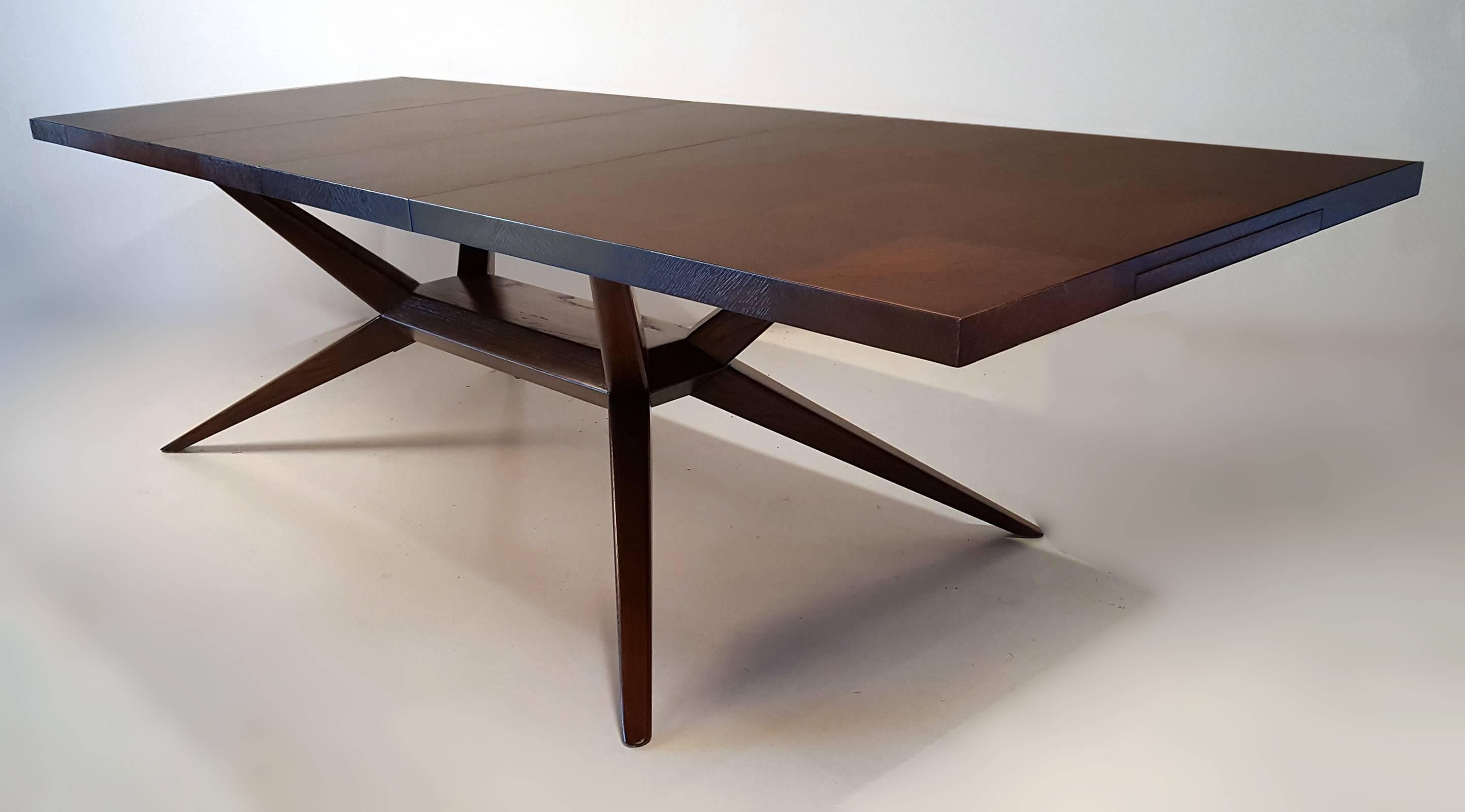 Stunning solid oak dining table by Harold Schwartz for Romweber. The parquetry work on the top is subtle but phenomenal. This table is one of the most unique designs from the period. It has been professionally refinished in a chocolate brown