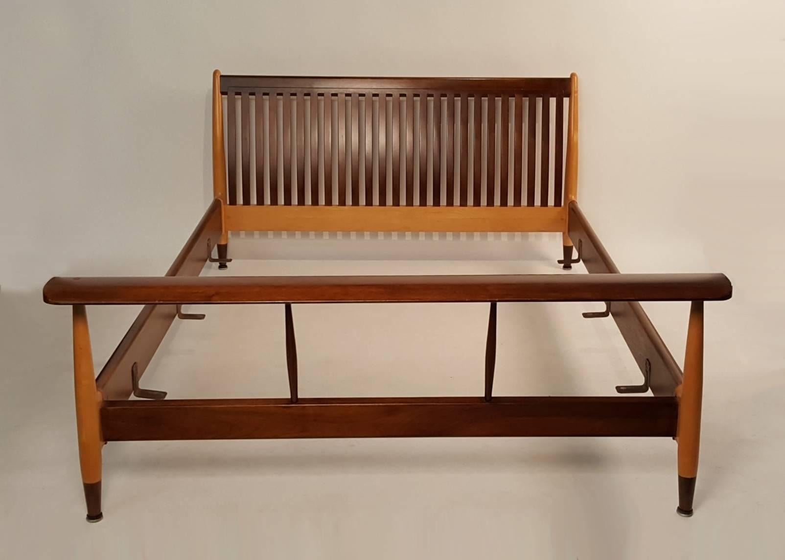Rare Finn Juhl designed double bed frame in solid maple and walnut. Produced in the early 1950s by Baker furniture. Will accommodate a 54 x 74