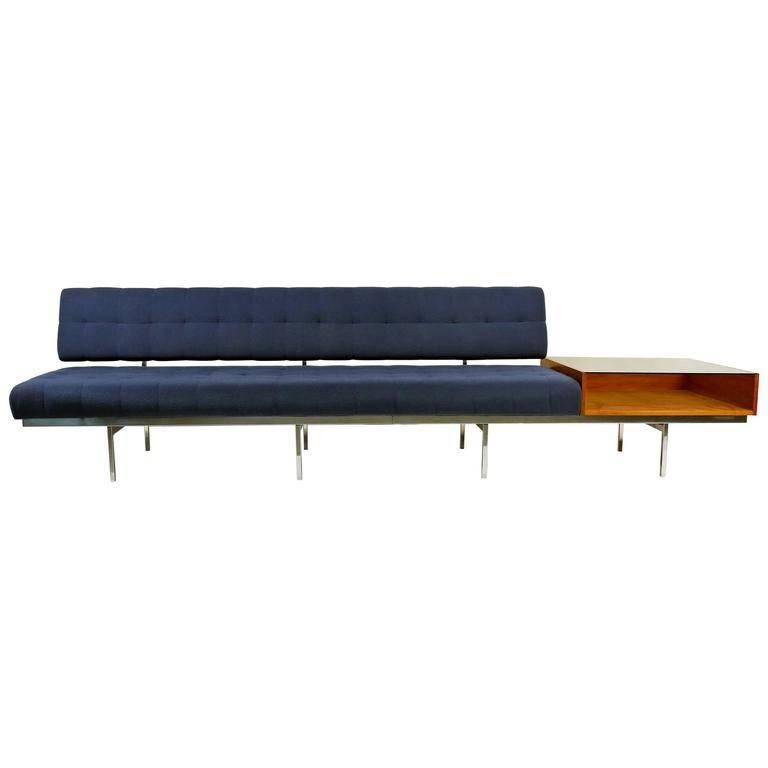 Very early and hard to find Florence Knoll Architectural sofa on chrome frame with attached walnut display table. This is the best variation of this piece with the glass top table and the premium chrome-plated frame. It works well against a wall but