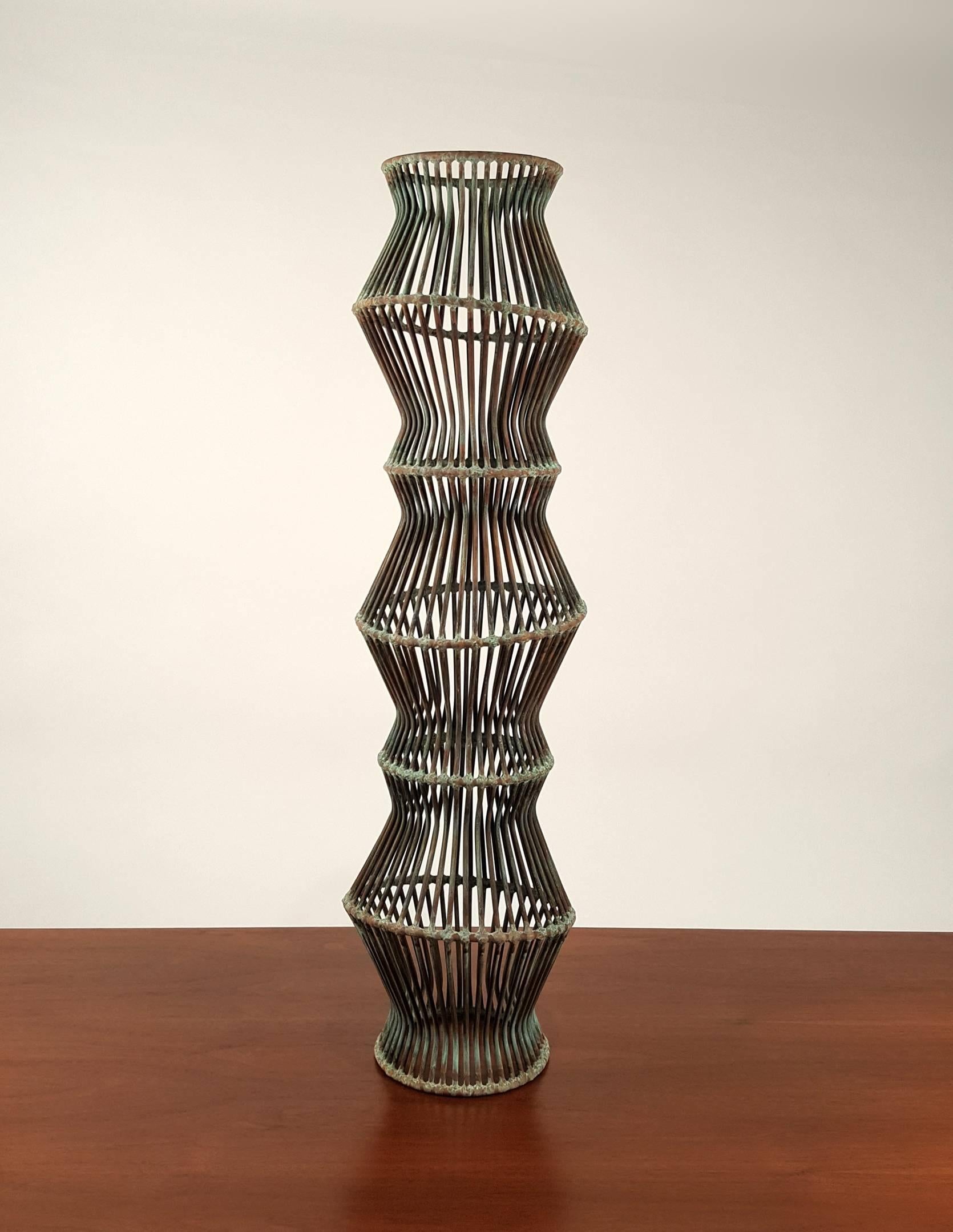 Amazing hand welded undulating copper and bronze rod sculpture with a Verdigris patina created by contemporary sculptor Douglas Ihlenfeld. This work is a one of a kind piece from his 'progression' series. The sculpture displays well from every angle