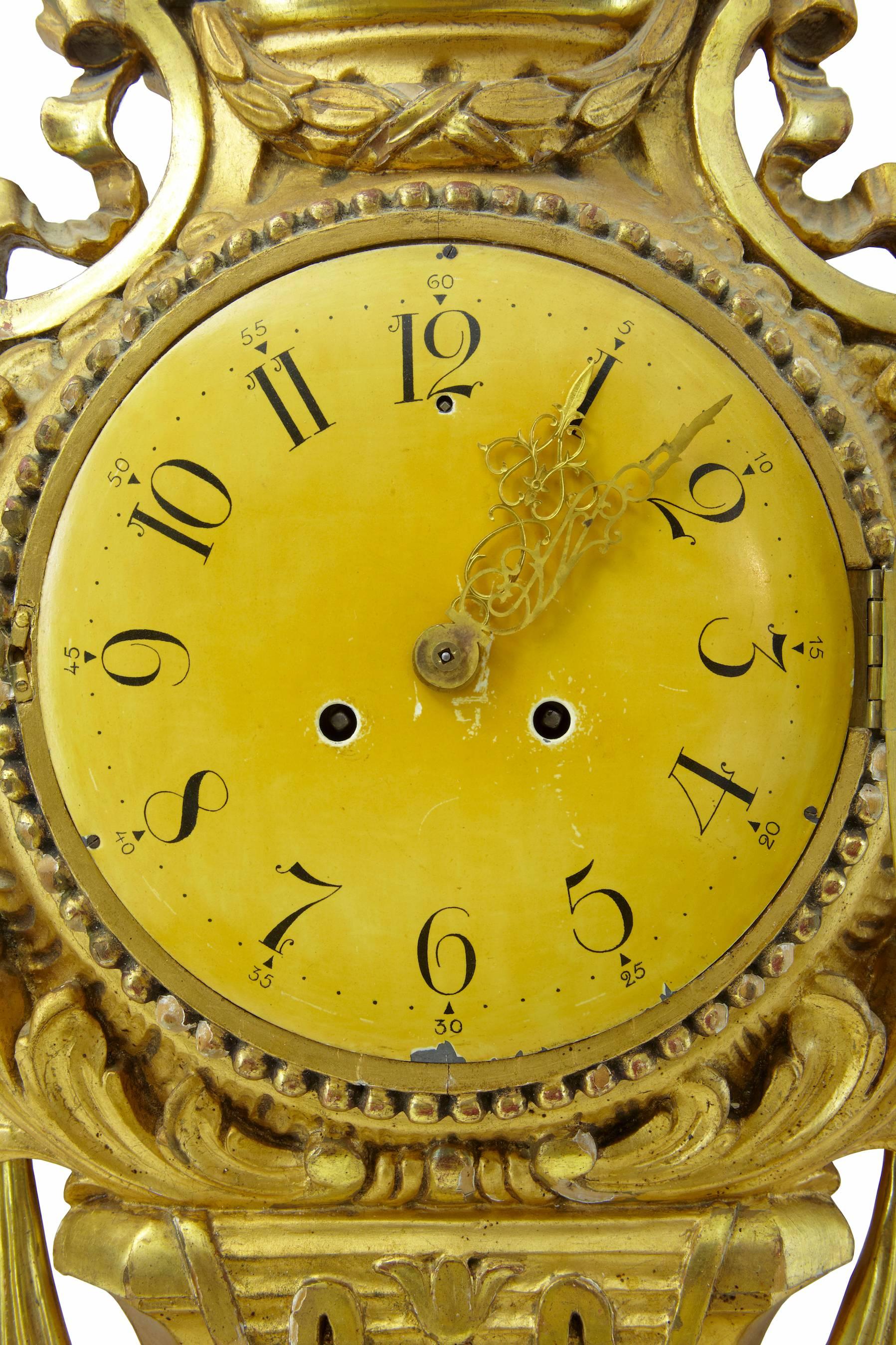 Fine quality clock in untouched condition circa 1930.
Carved on the reverse with the date 28/3 - 1934.
Carved with florals and swags very much in the rococo taste.
Original glass.
Marks to dial and minor enamel loss.
Some losses to