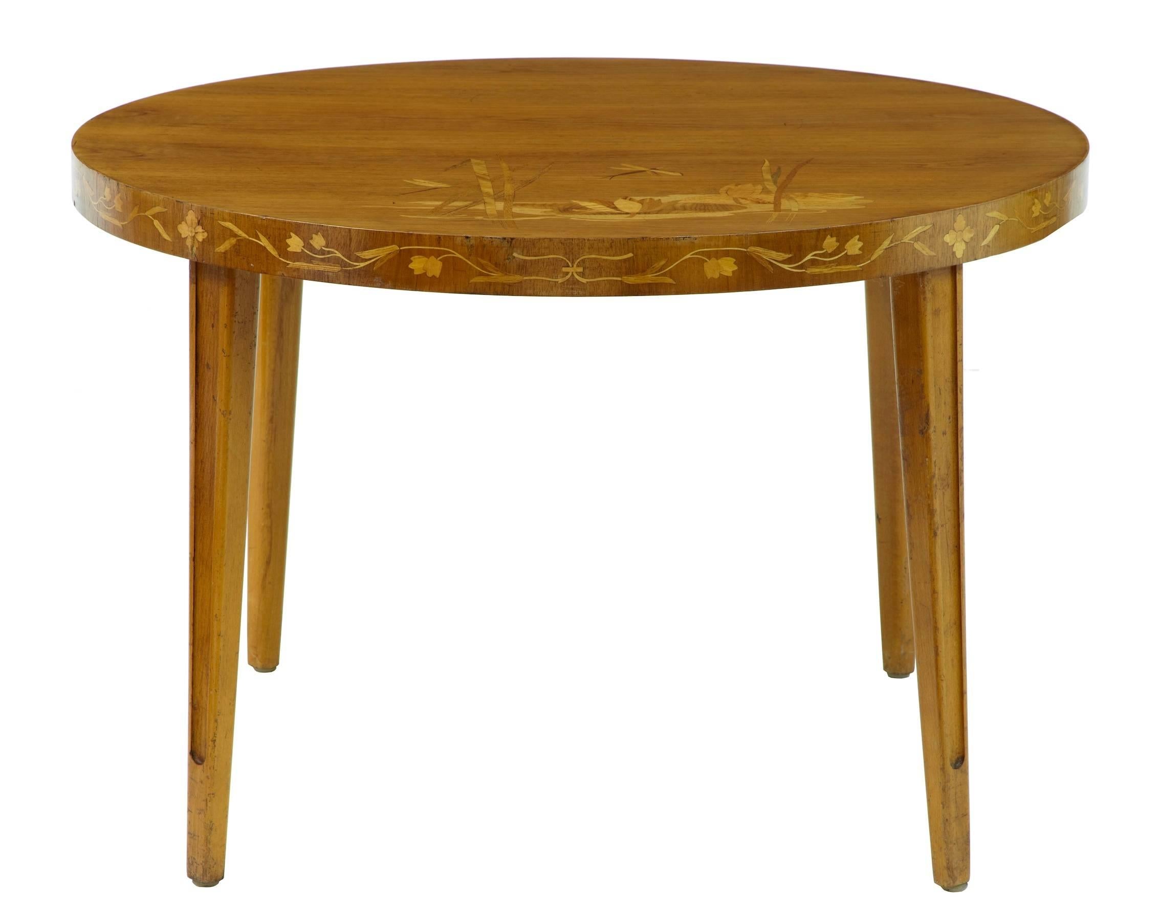 Swedish birch inlaid occasional table, circa 1950.
Inlaid in the oriental style with lilies and dragonfly
some minor marks to veneer.
Measures:
Height 23 1/2